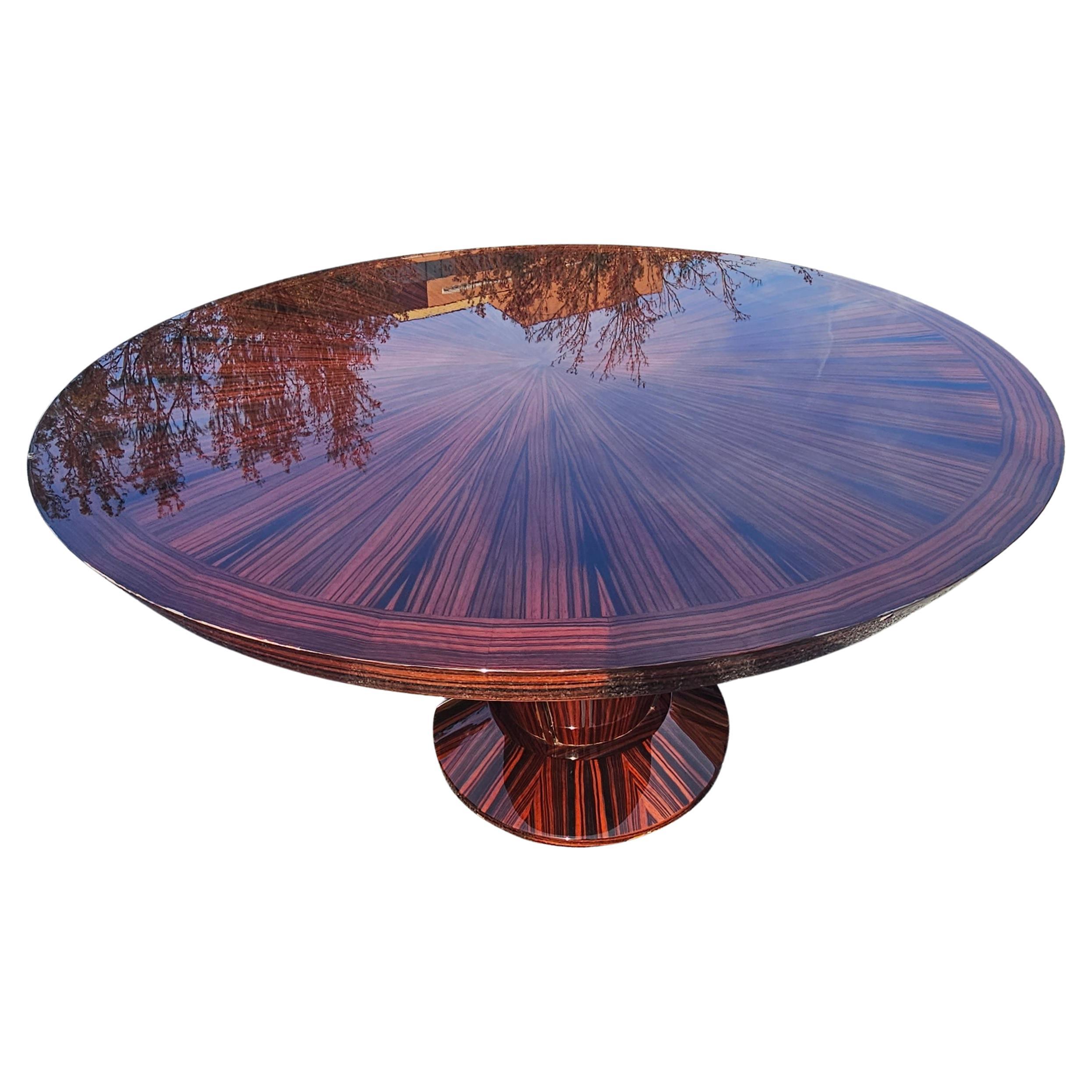 A 21st Century modern Dakota Jackson Heraldic Collection round dining table in great vintage condition. 
The eye-catching, geometric patterns identifying the natural beauty of santos rosewood and ebony are is the hallmark of this imposing round