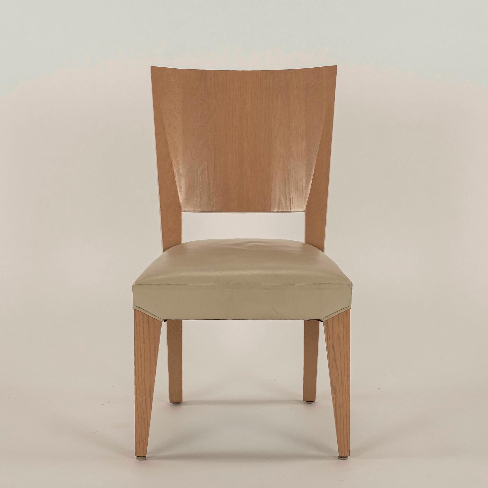 Ready to ship, vintage custom solid white oak Dakota Jackson Ocean side chair(s) upholstered in a beige taupe leather seat. Inspired by bold forms seen in African Ashanti prayer stools with influence of Czech Cubism apparent in the use of broad