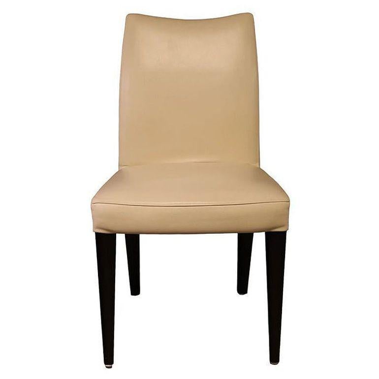 The Iko Side chair by Dakota Jackson features highly sculpted chairs, molded to the body. There are no straight lines on the upholstery which is sewn as a single piece and then stretched like a glove pulled over the frame. High style comes from