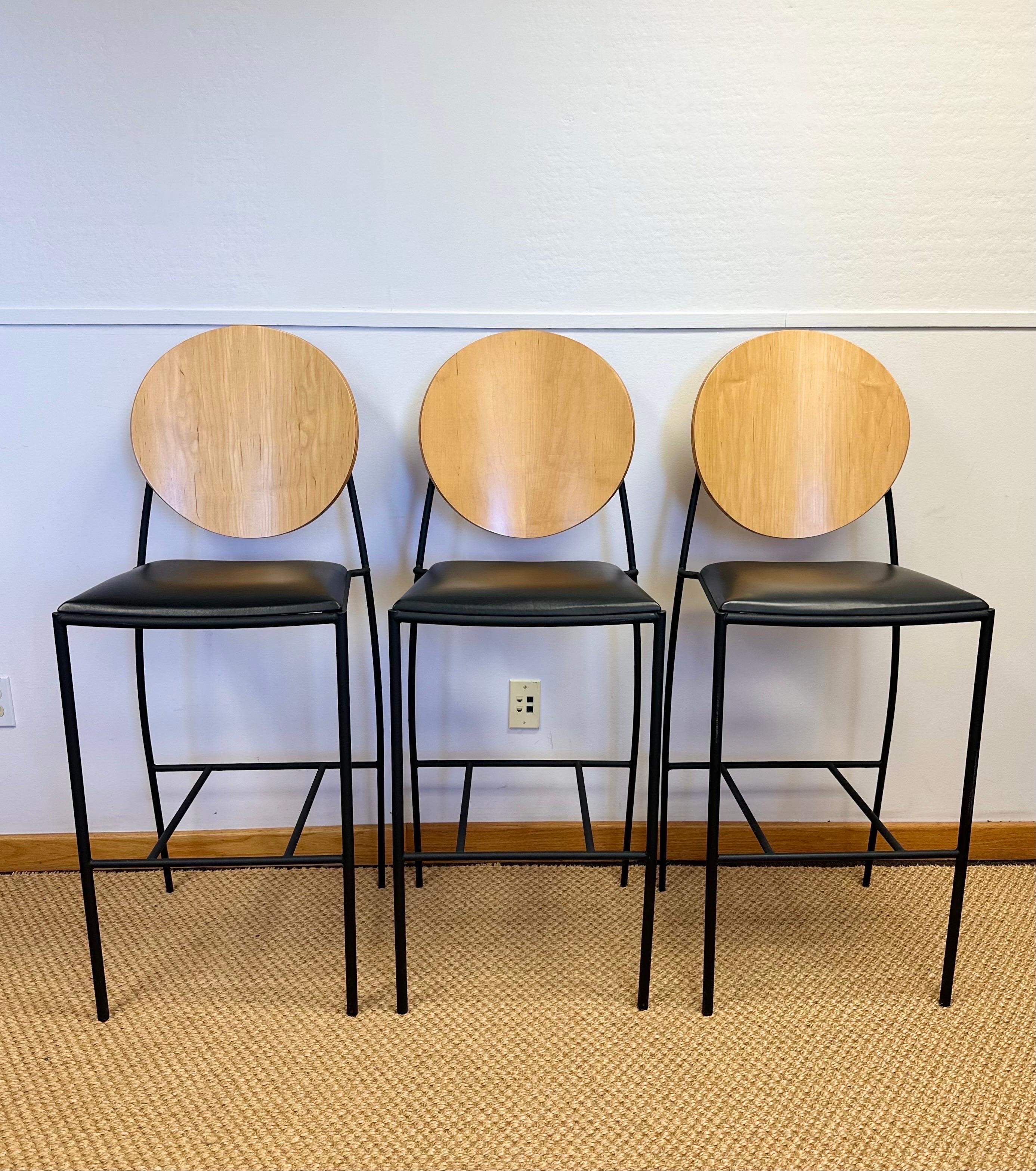 We are very pleased to offer a set of three bar counter stools by renowned American furniture designer Dakota Jackson, circa the 1990s. He began his career in the 1960s and gained recognition for his unique approach to furniture design, blending