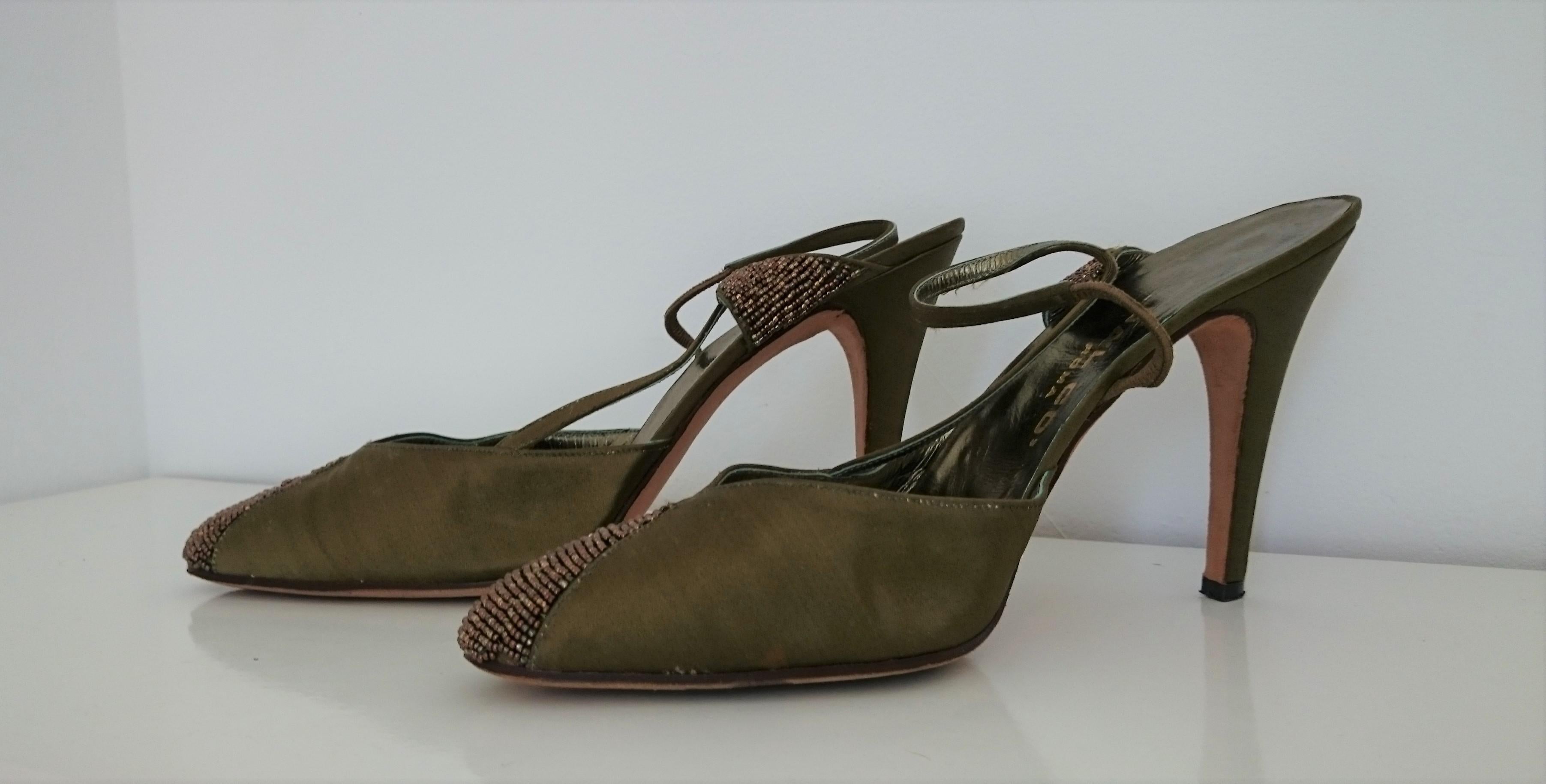 Valentino's Design Heels made by Dal Co' in Rome, Italy
They have a Green/Light-Brown color.
Made principally of Silk, Leather and with some green Brillants in the front.
Heel height:  10.2 cm
Conditions: Excellent
Size 8 (US)
Made in Italy