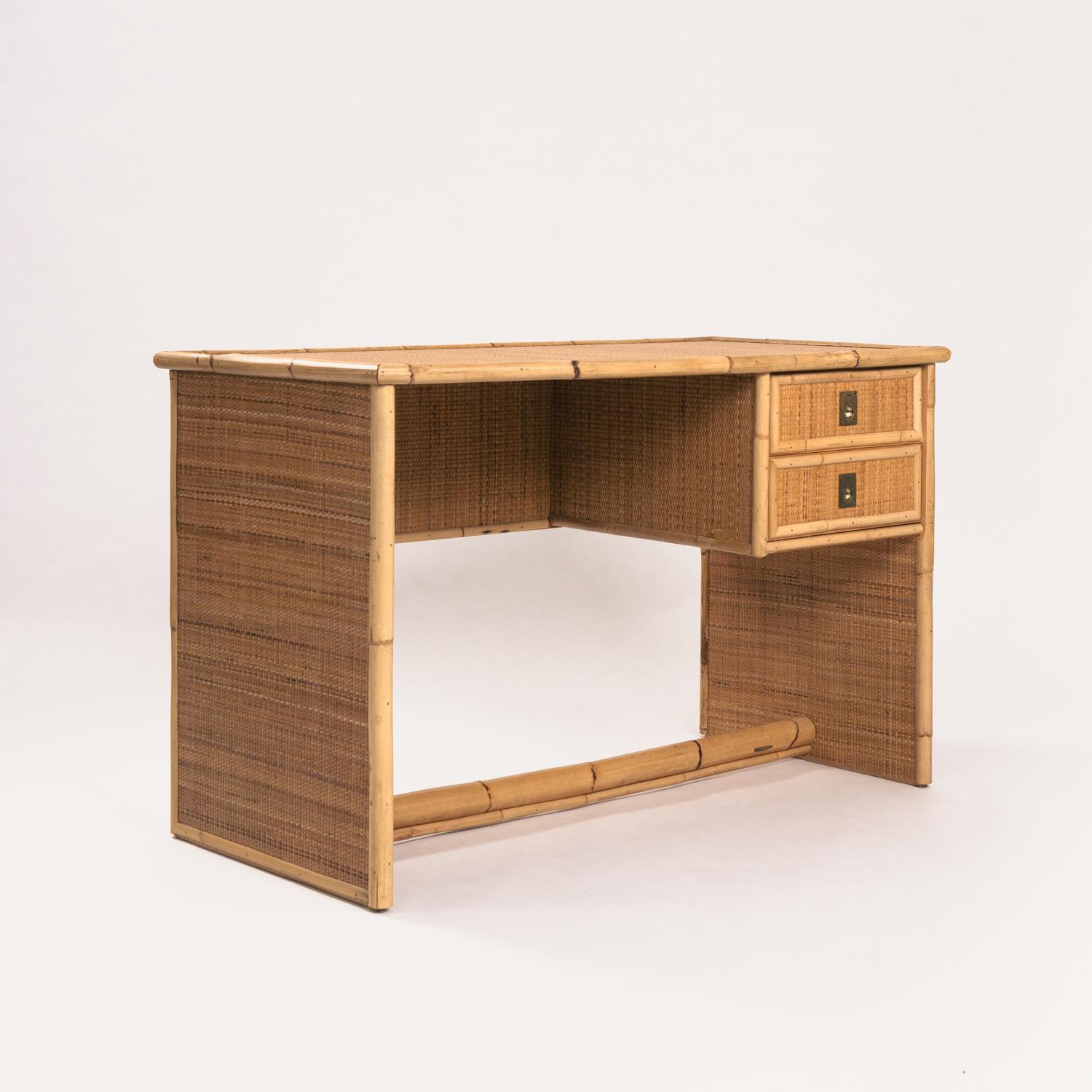 
Stylish compact wicker and bamboo writing desk with brass handles. Made by Italian company Dal Vera in 1979.
Bought from the first owner. Finished with wicker weaving on the sides and back so its looks amazing from all sides.
The space between the