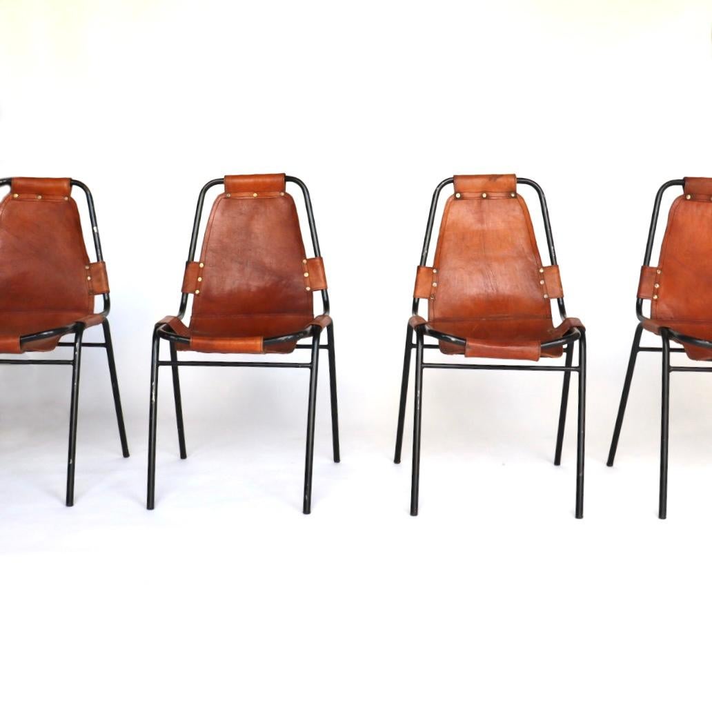 Les Arcs chairs with tubular chrome-plated metal framing and cognac leather seating. Chairs manufactured by Dal Vera and selected by Charlotte Perriand (1903-1999) for Les Arcs, a ski resort in the Alps in southeastern France. The design features a