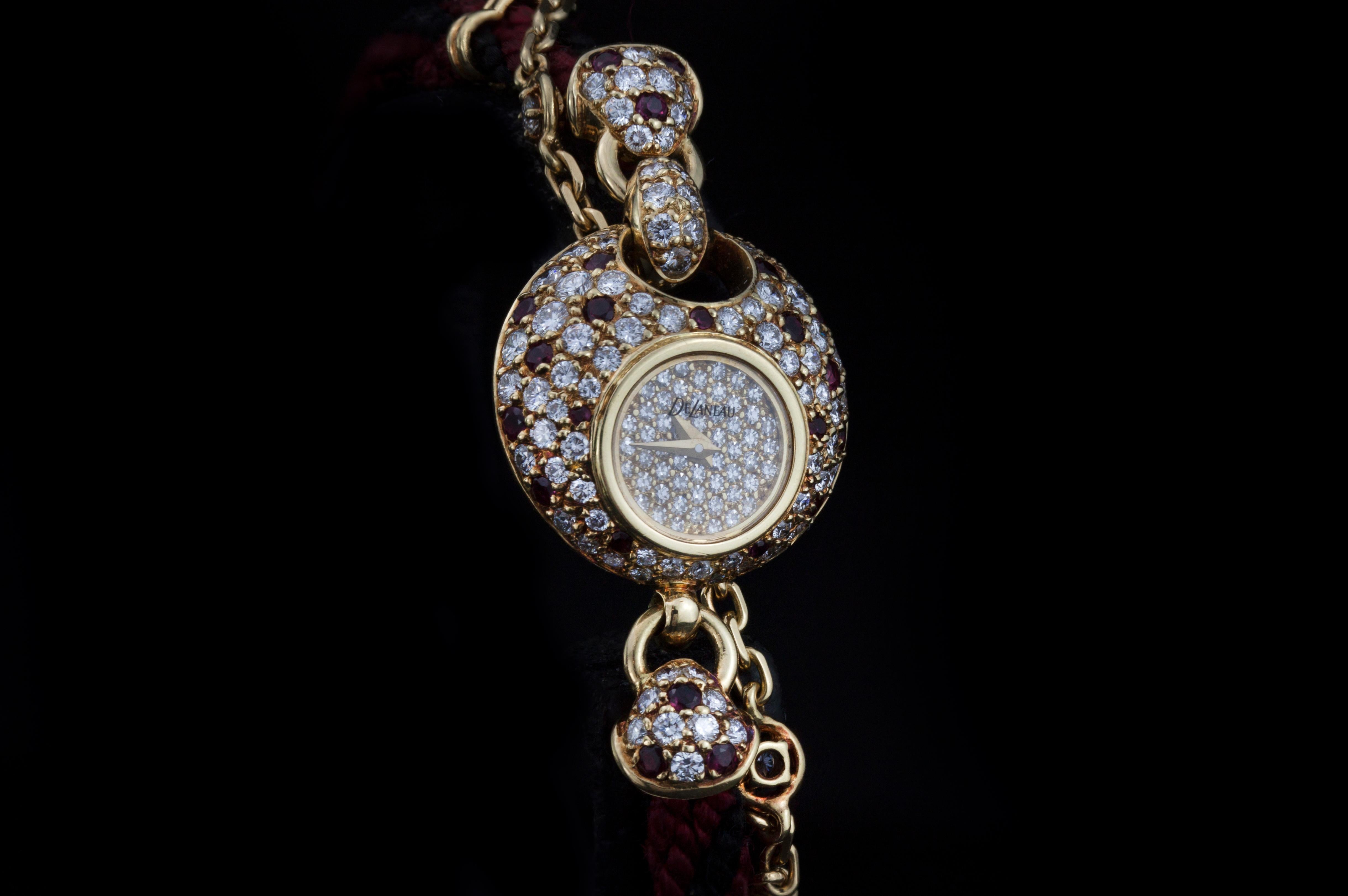 DaLaneau 18kt yellow gold ladies bracelet watch with diamonds and rubies, Circa 1980's

Gender:  Ladies
Case Size: 22 mm
Movement: Quartz
Watchband Material: 18kt gold and thread
Case material : 18kt gold
Display Type:   Analogue
Dial: See