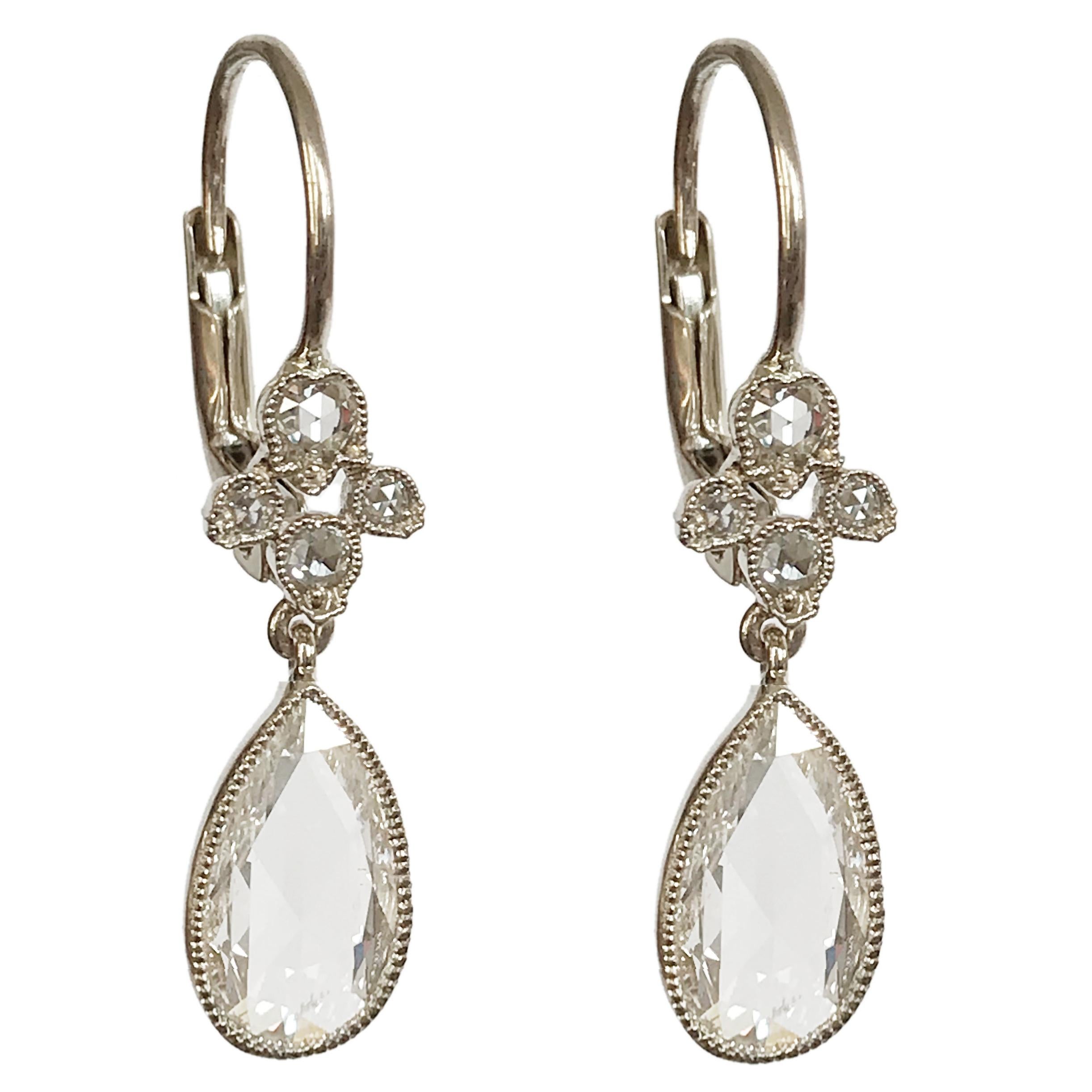 Dalben design One of a Kind 18k white gold earrings with two  bezel-set pear shape rose cut diamonds totl weight  2,51 carat and a floral motif  with rose cut diamonds weight 0,16 carat.
The stone setting is finished with 
