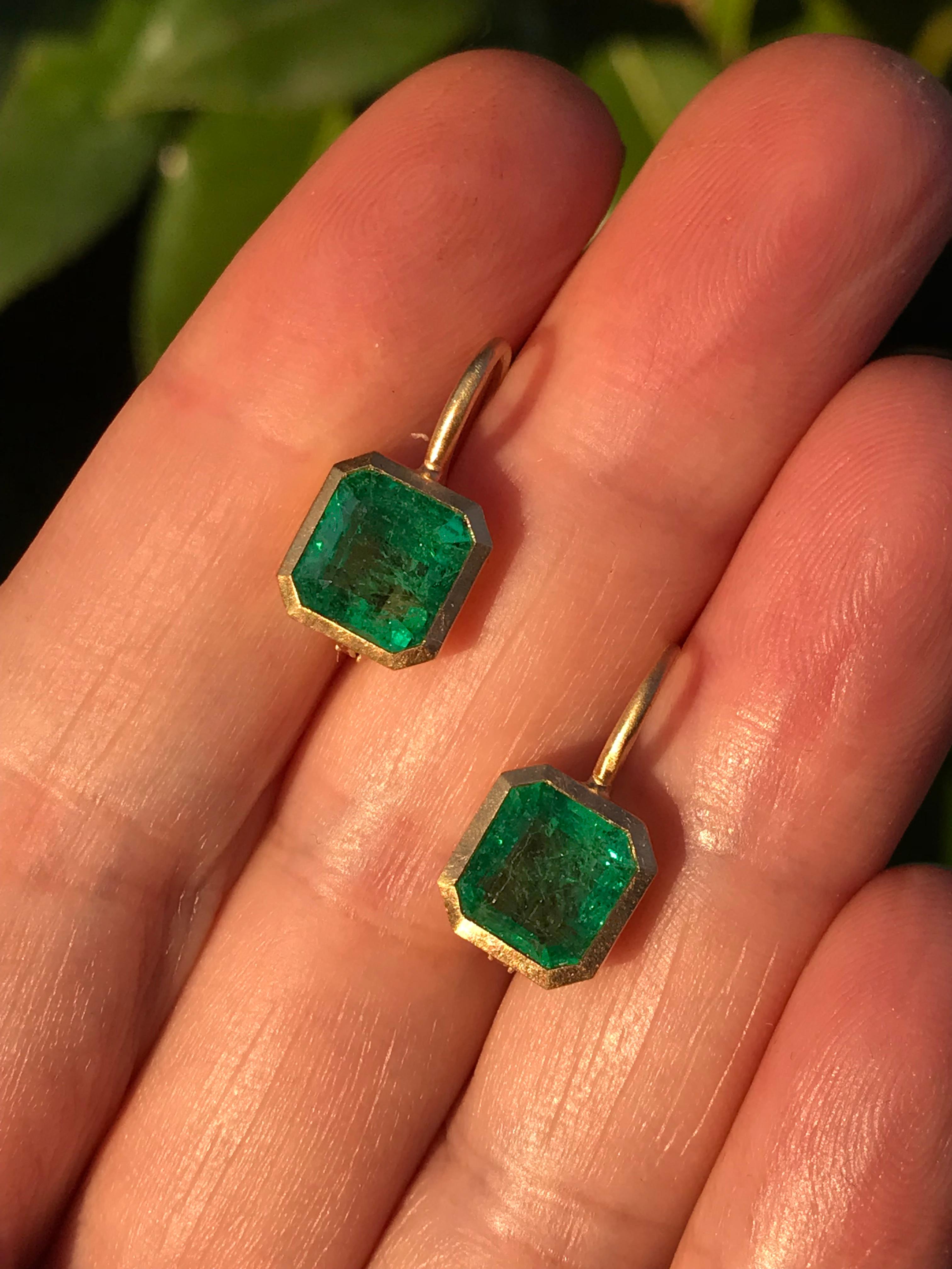 Dalben design  18k yellow gold matte finishing earrings with two bezel-set emerald faceted cut  Zambian emerald weight 4,2 carats .
The emeralds have a deep green color
They are slightly different in dimension ,  
Bezel stone dimensions :
 9,1 x 8,7