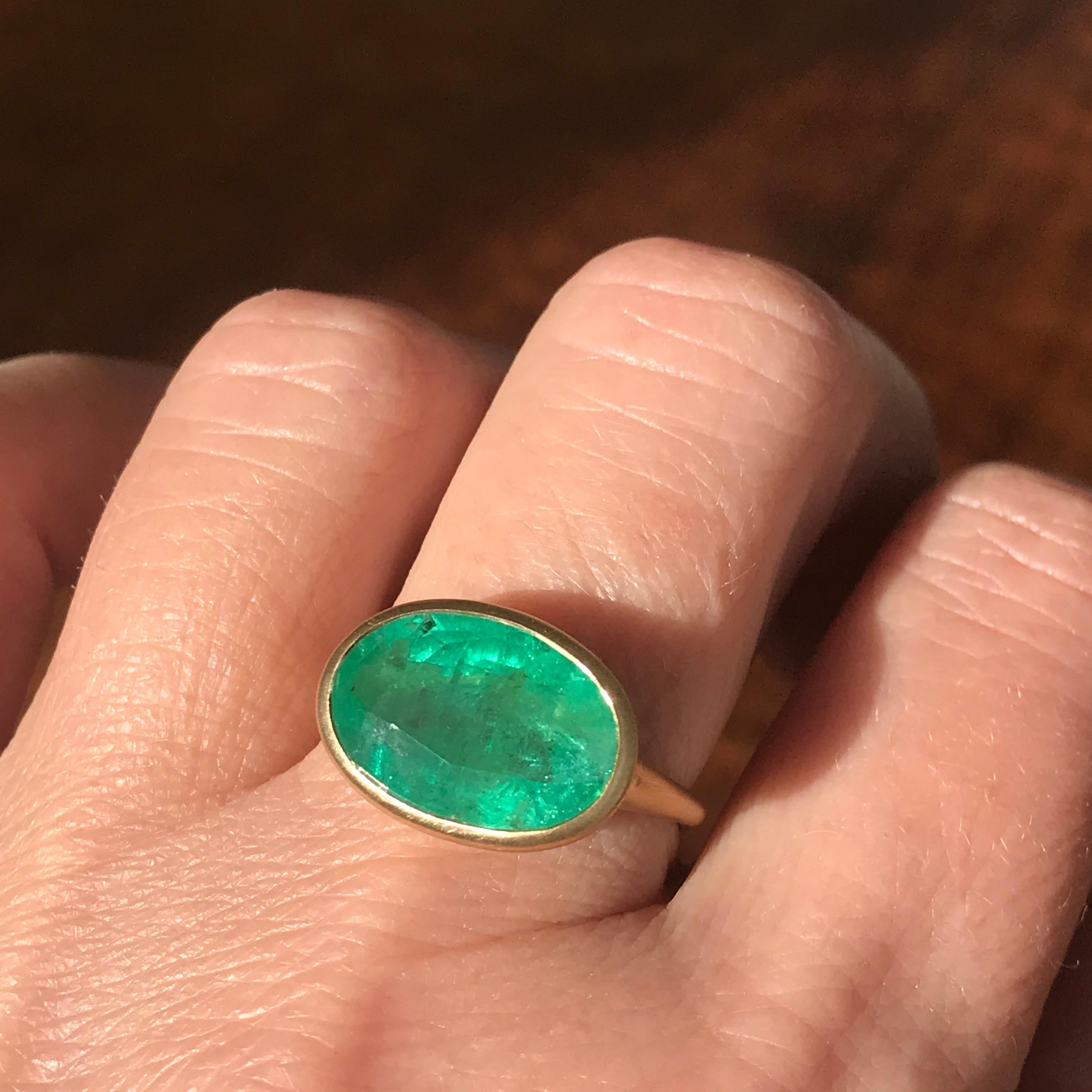 Dalben design One of a Kind 18k yellow gold matte finishing ring with a 5,5 carat bezel-set oval cut emerald. 
Ring size 7 1/4 USA - EU 55 re-sizable to some finger sizes. 
The emerald have natural inclusions that are often called the jardin (French