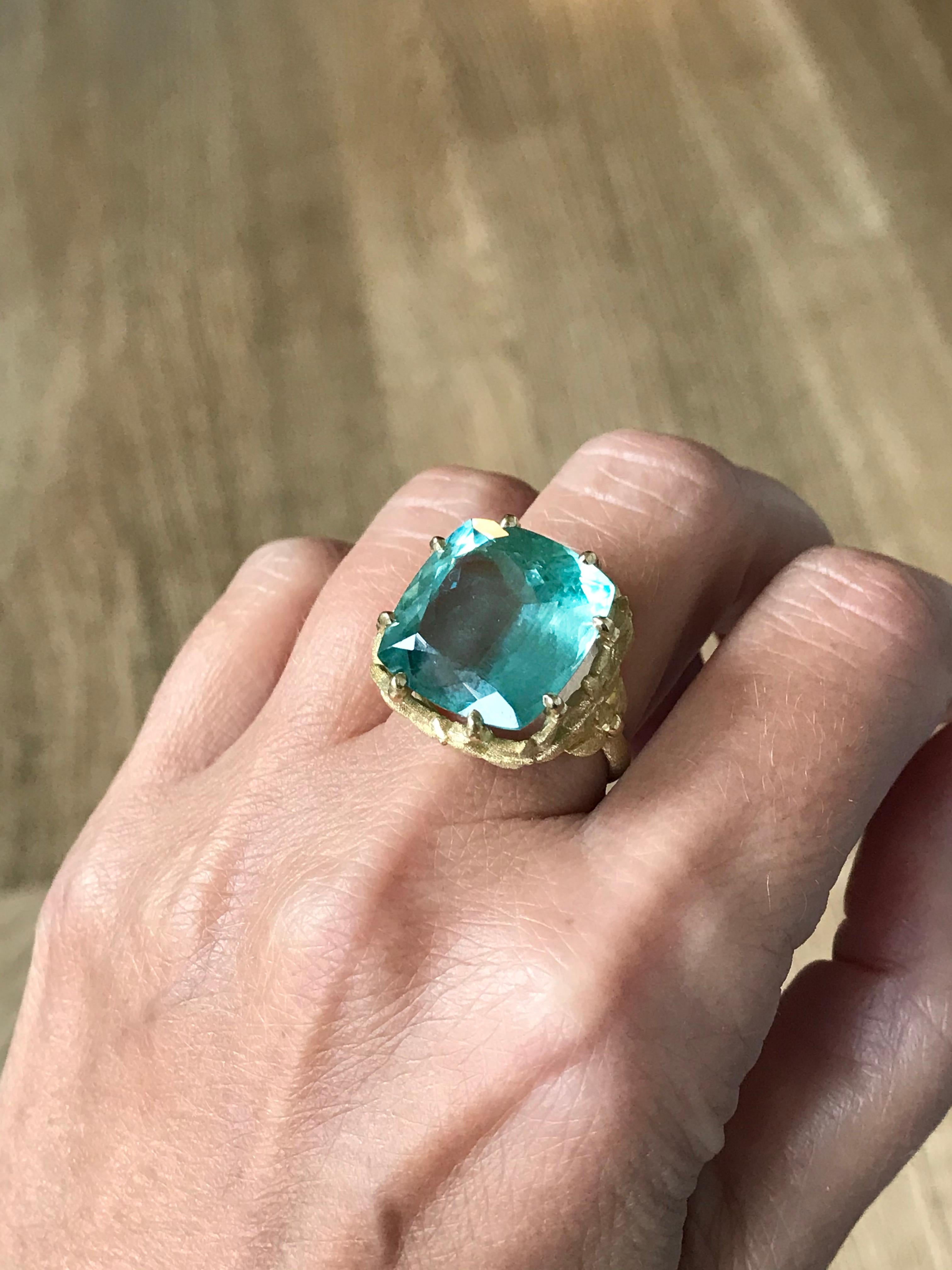 Dalben design 18 kt engraved yellow gold Cocktail Ring with a Cushion cut  blue-green Aquamarine weighting 17,7 carat .  
Ring size 7  1/4 USA - 55 EU resizable to most finger sizes.  
Bezel setting dimension: 
width 19,7 mm, height 19 mm.  
The