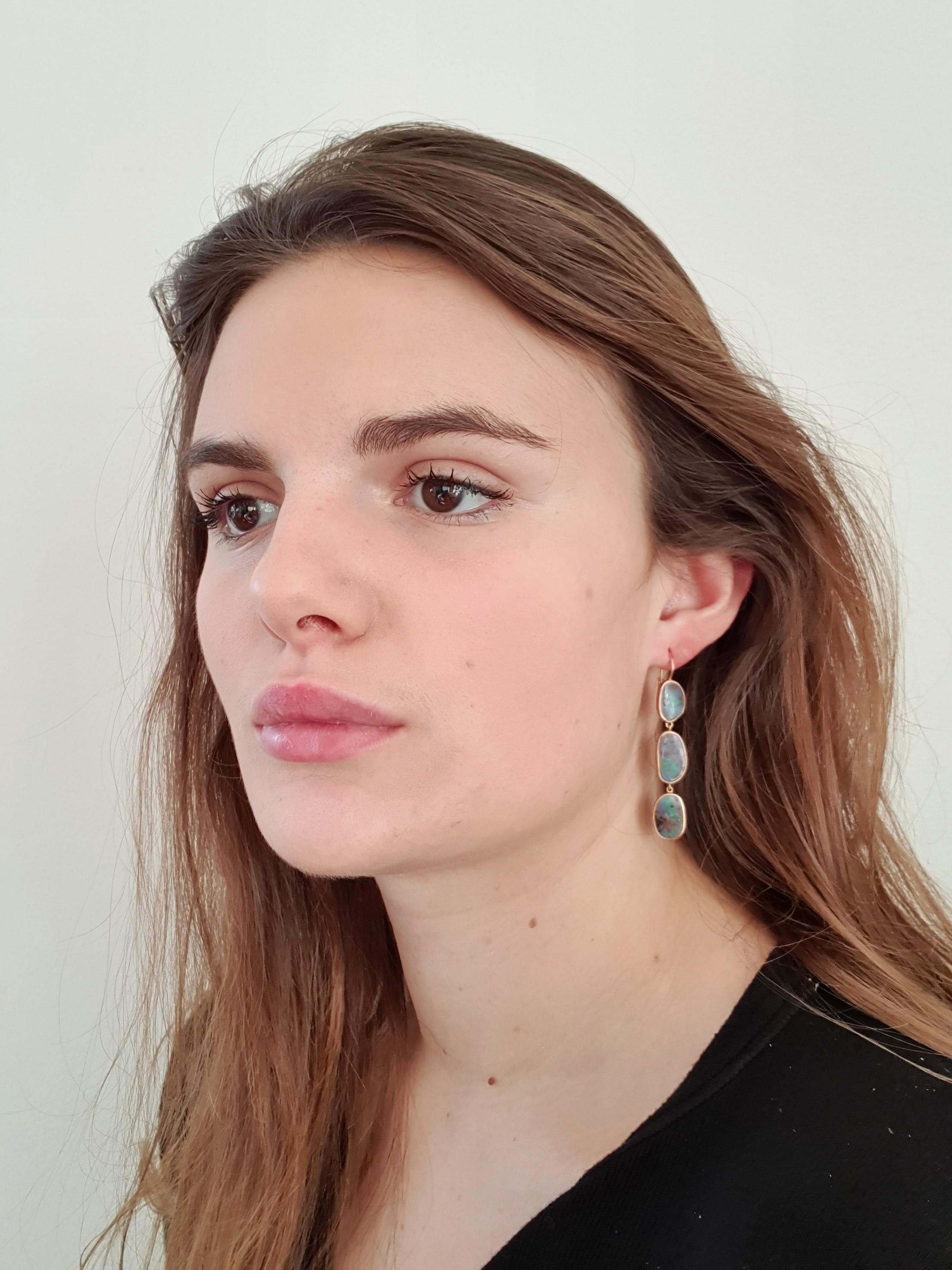 Dalben design One of a kind 18k rose gold matte finishing dangle earrings with six violet - green bezel set Australian Boulder Opals weighing 17,6 carats.  
max width 9,8 mm 
height without leverback 48 mm
height with leverback 57 mm  
The earrings