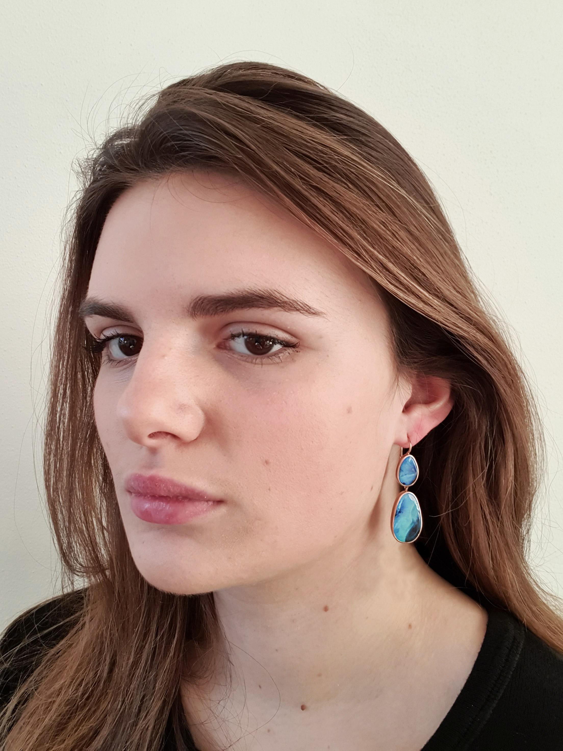 Dalben design One of a kind 18k rose gold matte finishing dangle earrings with 4  light blue bezel set Australian Boulder Opals weighing 25,72 carats.  
max width 14,50 mm 
height without leverback 41 mm
height with leverback 47-48 mm  
The earrings