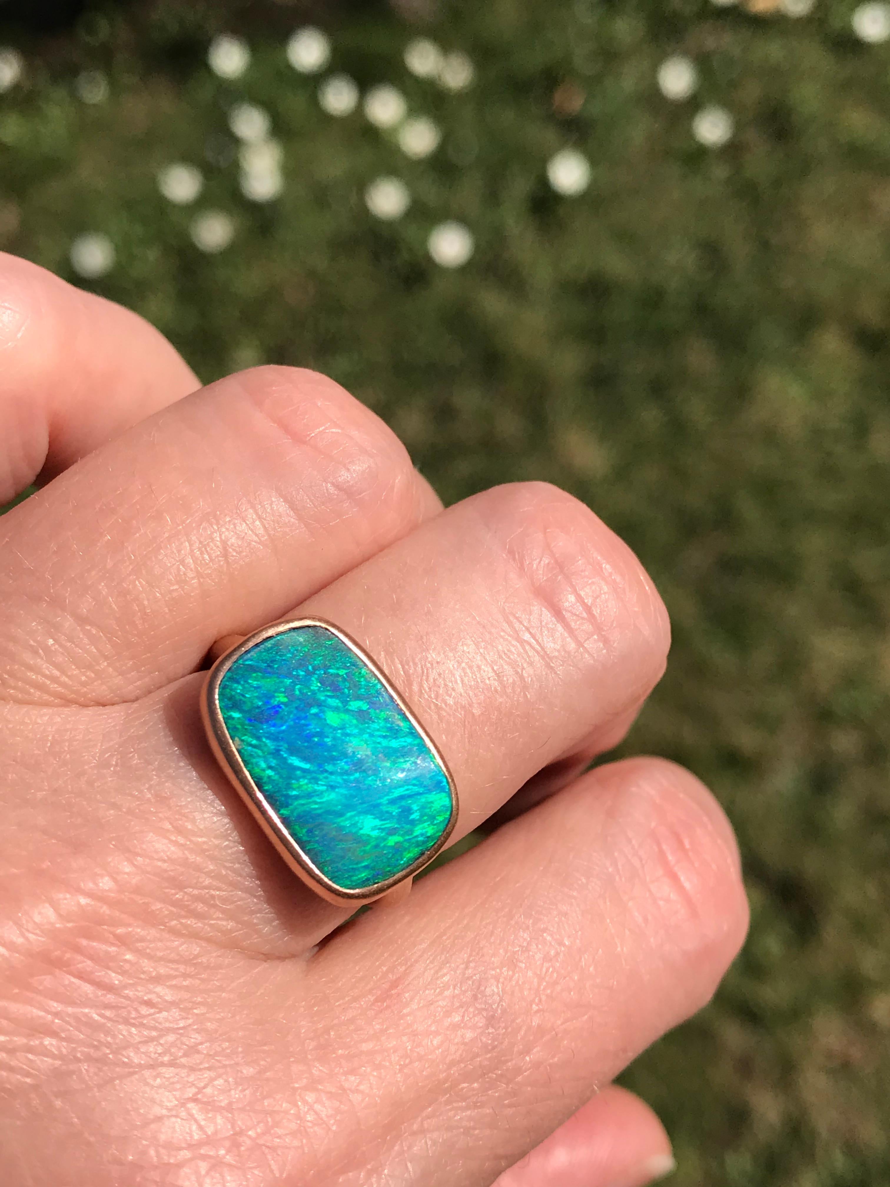 Dalben design 18k rose gold matte finishing ring with a 6,10 carat bezel-set cushion cut blue green Australian Boulder Opal . 
Ring size 7 US - 54 EU re-sizable to some finger sizes. 
Bezel setting dimension: 
width 18 mm, 
height 11,6 mm. 
The ring
