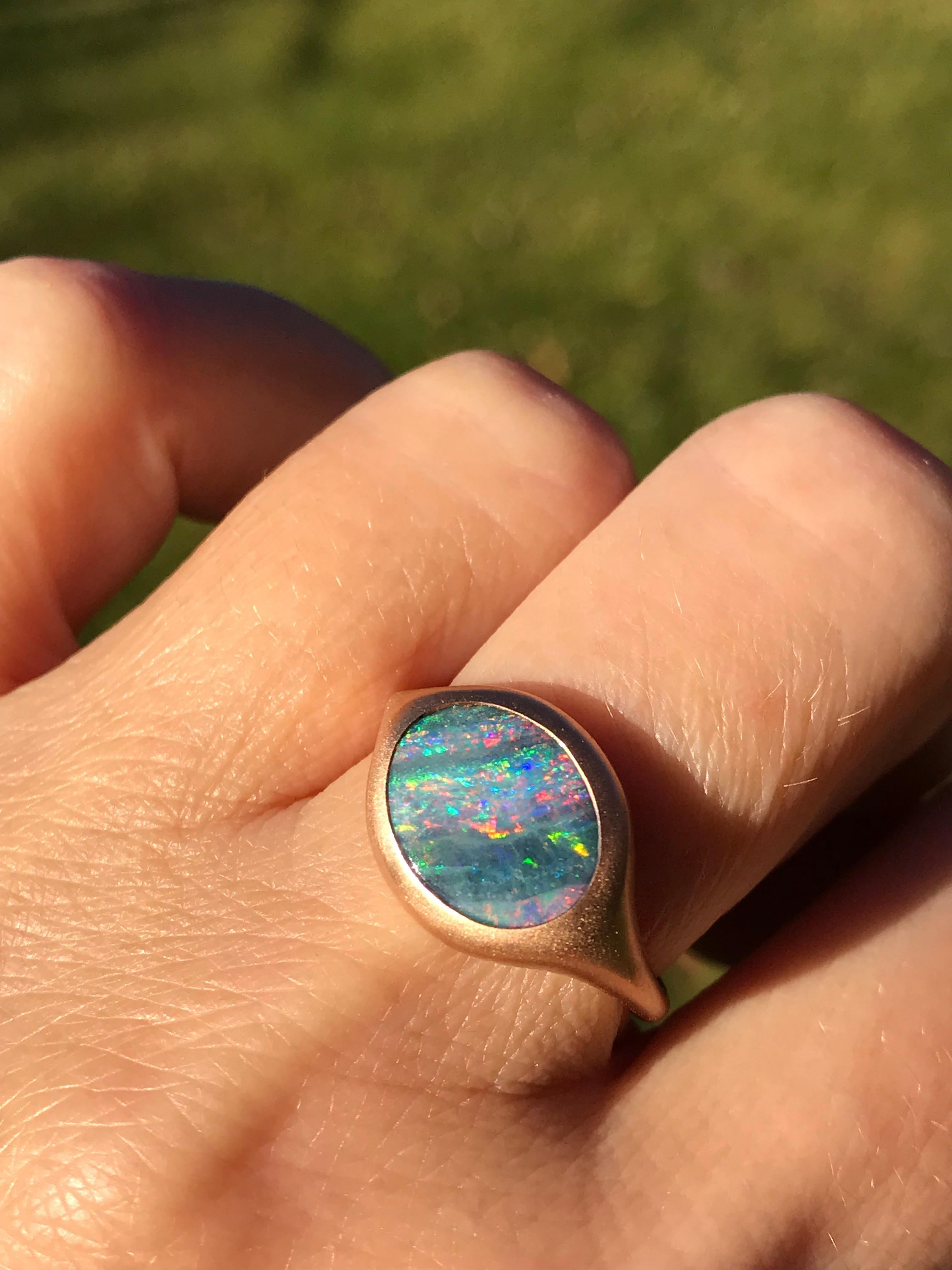 Dalben design 18k rose gold satin finishing ring with a  2,77 carat bezel-set oval Australian boulder opal 
The Australian Opal have pink , blue and green spots.
Ring size US  6 3/4  - EU 54 re-sizable to most finger sizes. 
Bezel setting dimension: