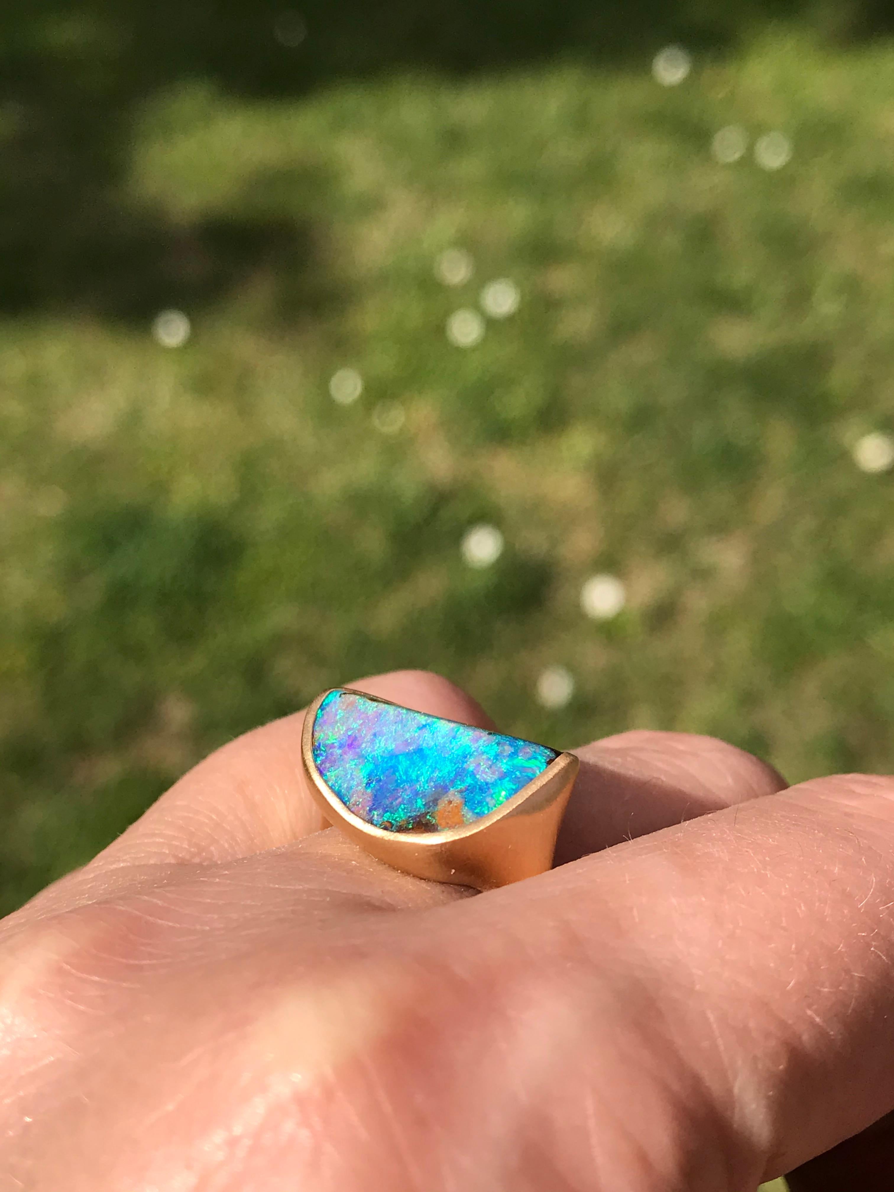 Dalben design 18k yellow gold matte finishing ring with a 9 carat bezel-set  blue green Australian Boulder Opal . 
The stone sea bed colors  are azure - green with green light spots.
The  shape have a curve surface like a wave. 
Ring size 7 3/4 US -