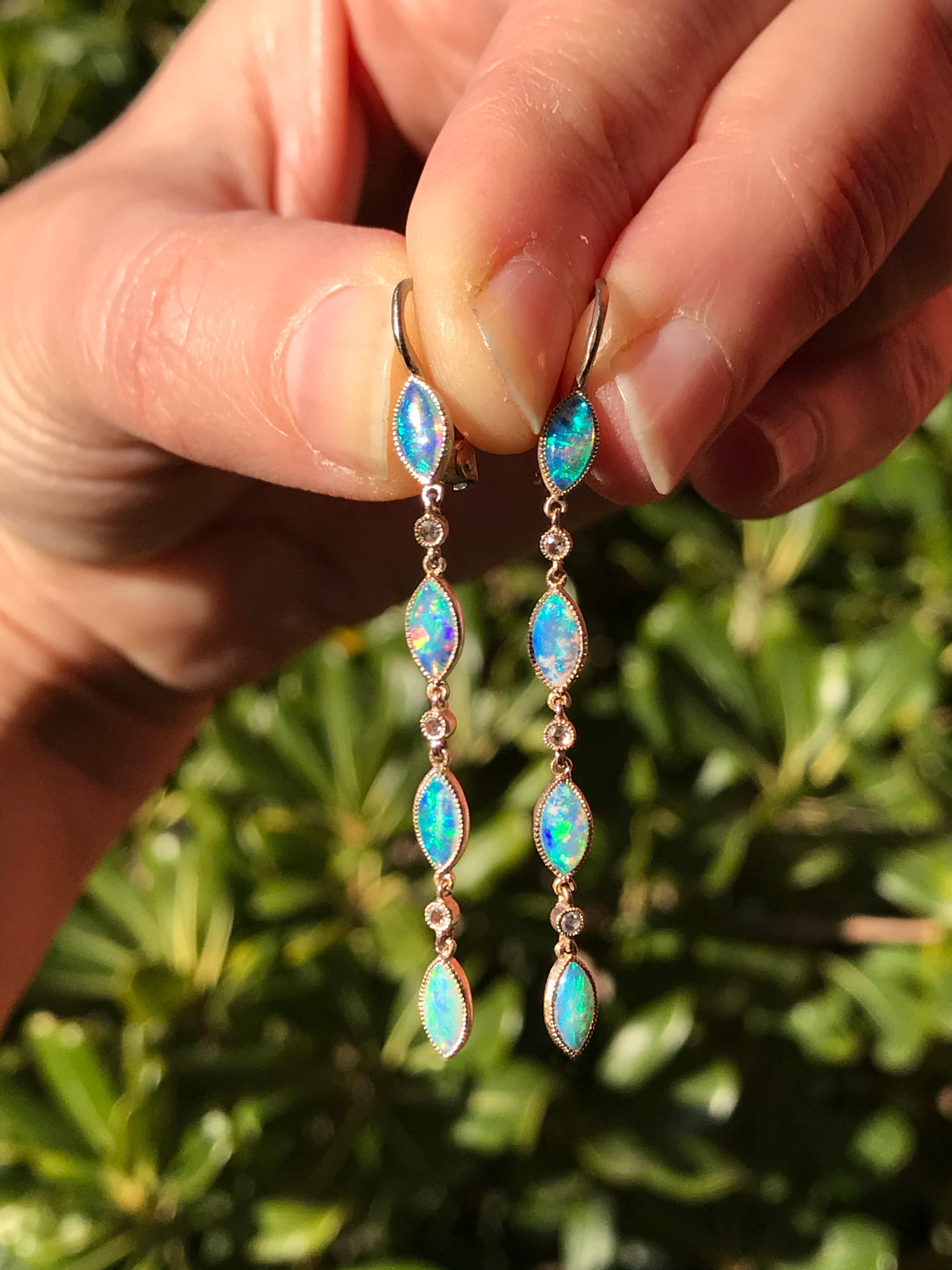 Dalben design Opal drop earrings with 8 blue-green Australian Opals and 6 rose cut Diamonds weight  0,06 carats mounted in 18 kt  white gold. 
Dimension: 
width 3,8 mm 
height without leverback 43 mm
height with leverback 51 mm
The earrings has been