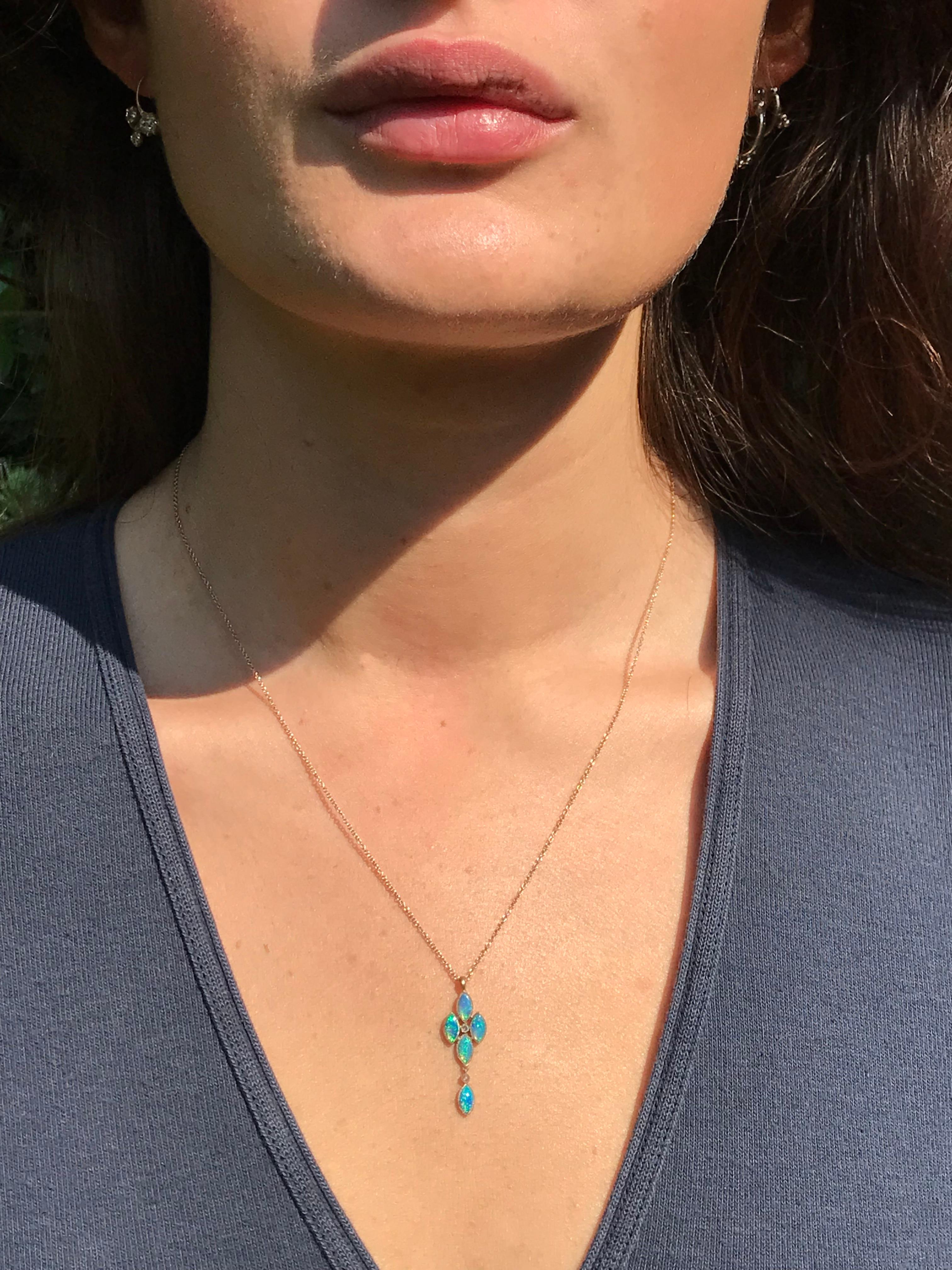 Dalben design Opal pendant necklace with 5 blue-green Australian Opals and 2 rose cut Diamonds weight  0,02 carats mounted in 18 kt  white gold. 
Pendant dimension: 
max width 9,5 mm 
height 30 mm
height with leverback 34 mm
Chain length 48 cm ( 19