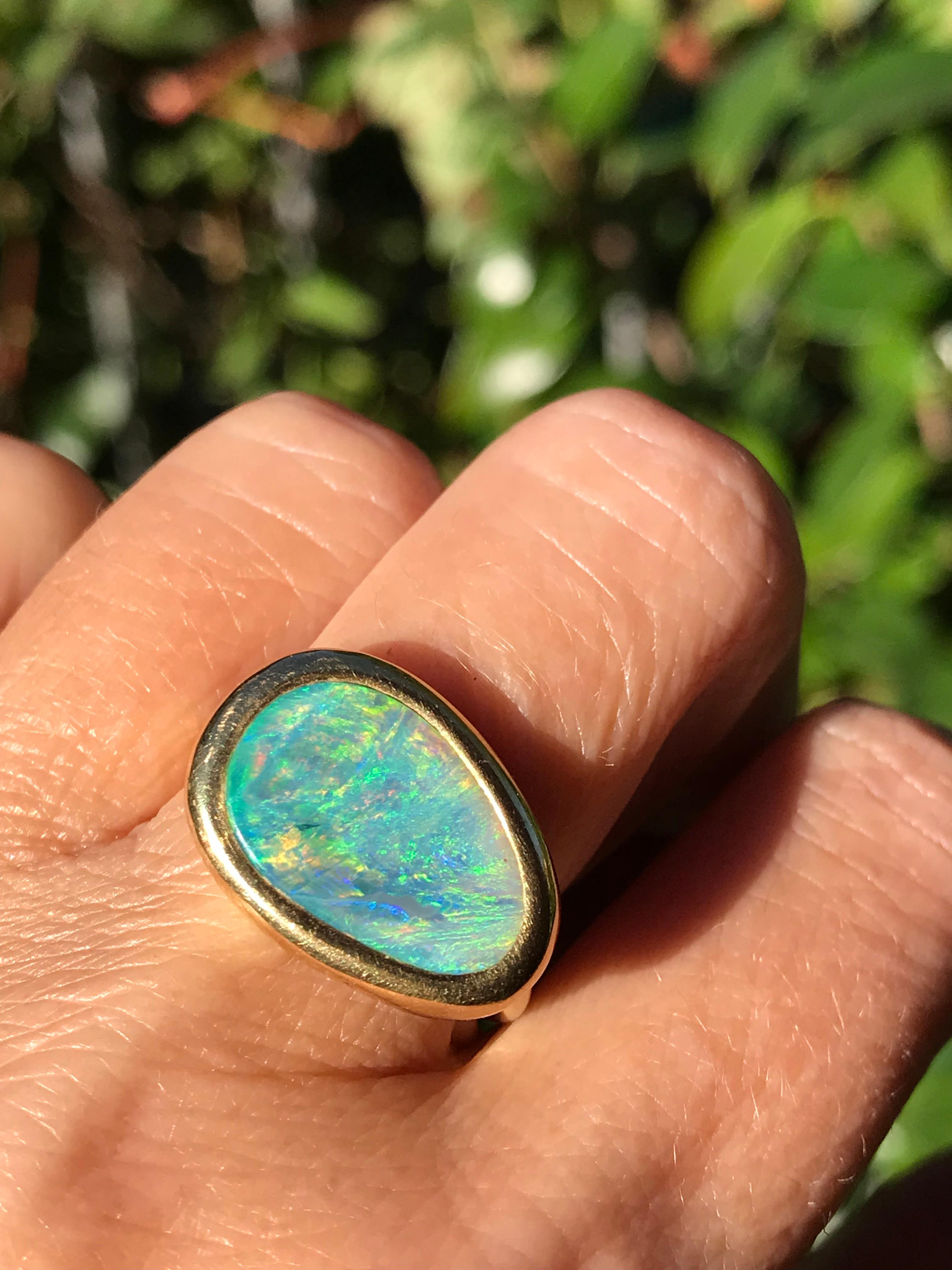 Dalben design One of a kind 18k yellow gold satin finishing ring with a 3,4 carat bezel-set lovely Australian Lightning Ridge Opal .  
The stone colors looks like a Sardinia bay sea .  
Ring size 6 3/4 - EU 54 re-sizable to most finger sizes. 