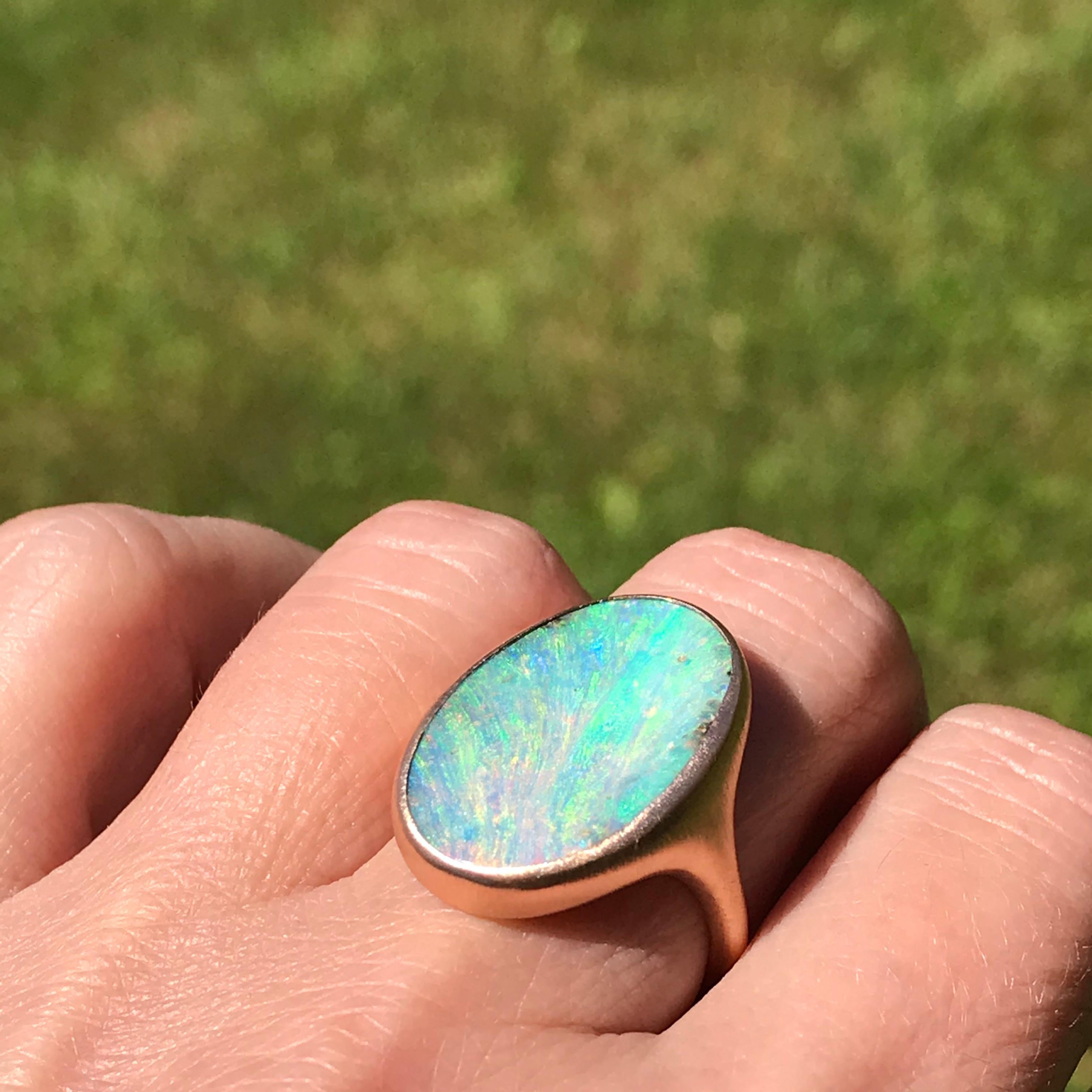 Dalben design 18k rose gold satin finishing ring with a 12,44 carat bezel-set oval light blue Australian Boulder Opal.
The opal has pastel light blue-green colors with some pink waves.
Ring size 6 3/4 - EU 54 re-sizable to most finger sizes.
Bezel