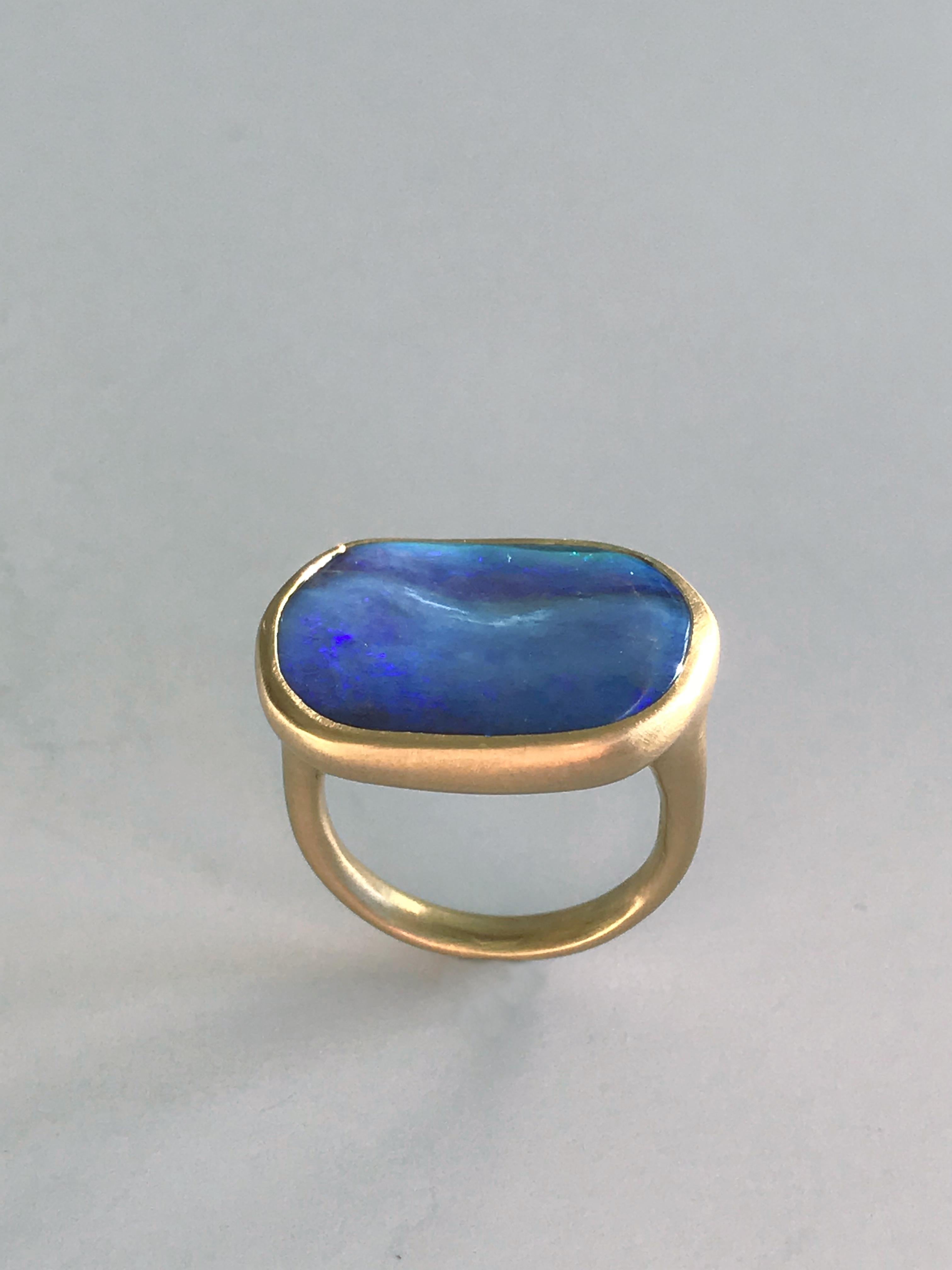 Dalben design One of a kind 18 kt yellow gold matte finishing ring with a 13,5 carat bezel-set deep blue Australian Boulder Opal  .  
The stone has sea bed deep blue  colors .
Ring size 7 1/4 - EU 55 re-sizable to most finger sizes.  
Bezel setting