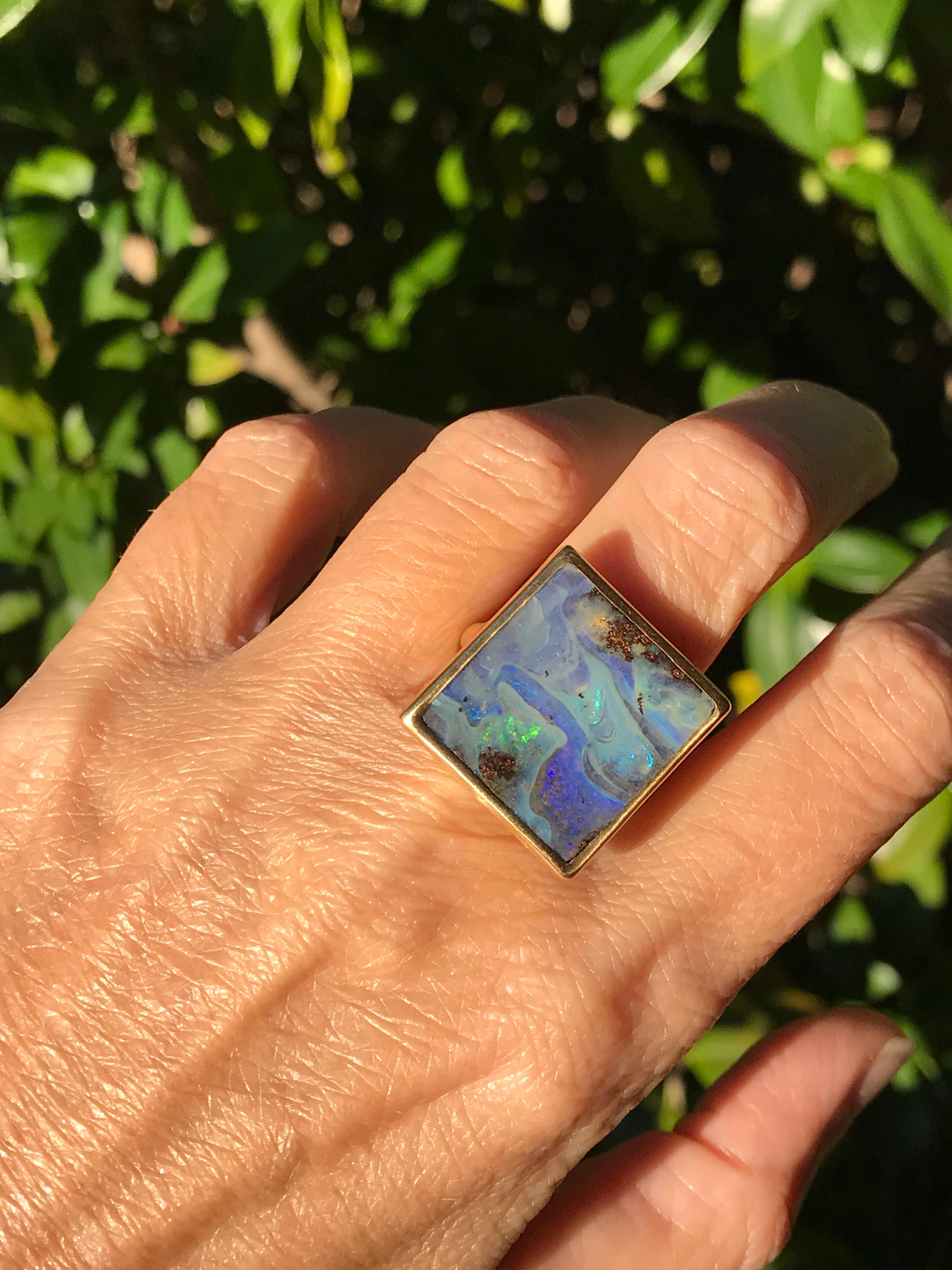 Dalben design One of a kind 18k yellow gold semi lucid finishing ring with a 13,7 carat bezel-set wonderful rectangular Boulder Opal.  
This Australian Boulder Opal has the  seabed colors  
Ring size 7 1/4 US - 55 EU re-sizable to most finger sizes.