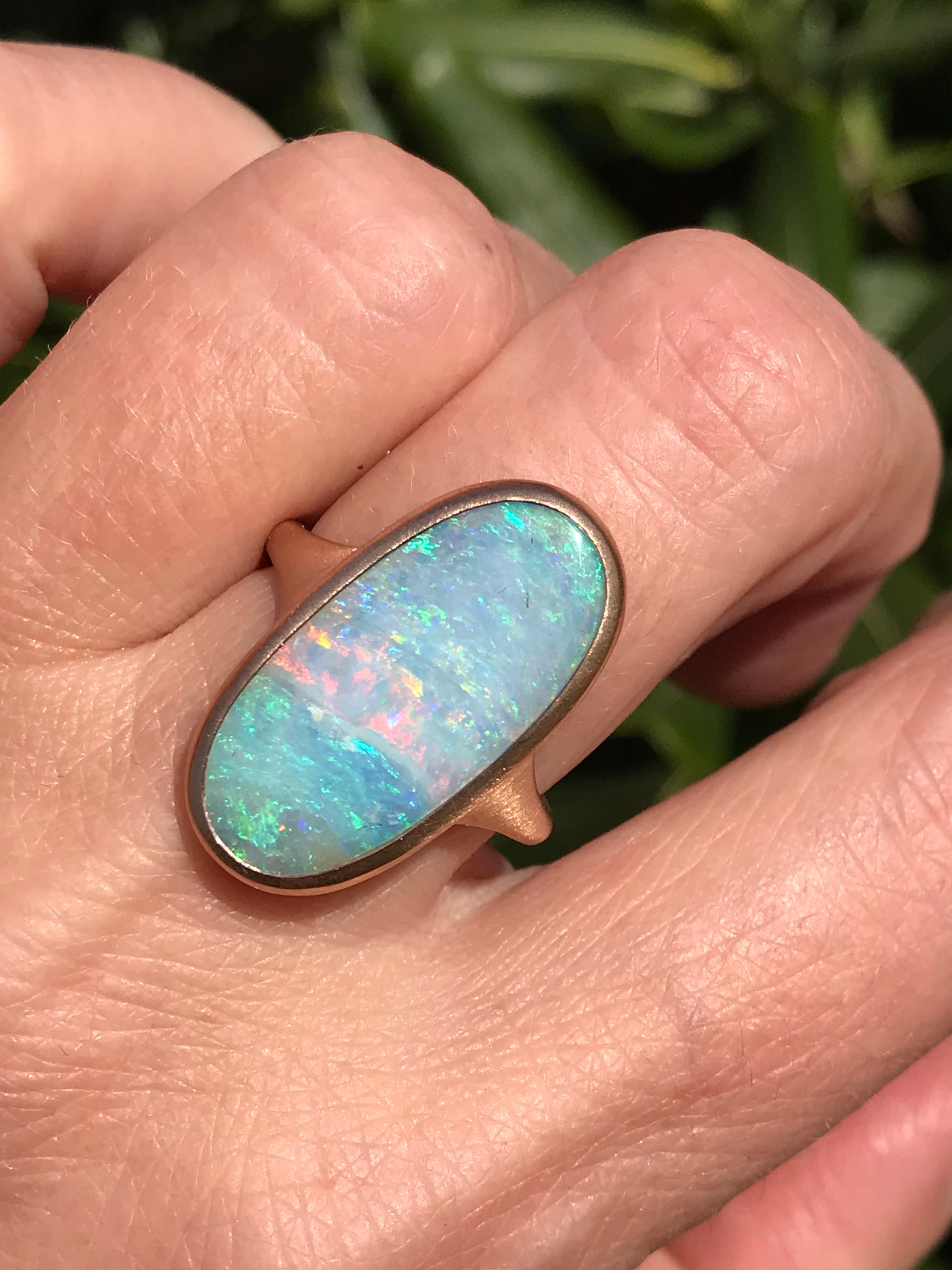 Dalben design One of a kind 18 kt rose  gold ring with an oval cabochon solid Australian Boulder Opal weight 18,34 carats  .
Ring size  US 7    -  EU 54 1/2 re-sizable .  
Bezels setting dimension:  
max width 12,9 mm,  
max height 24 mm. 
The ring