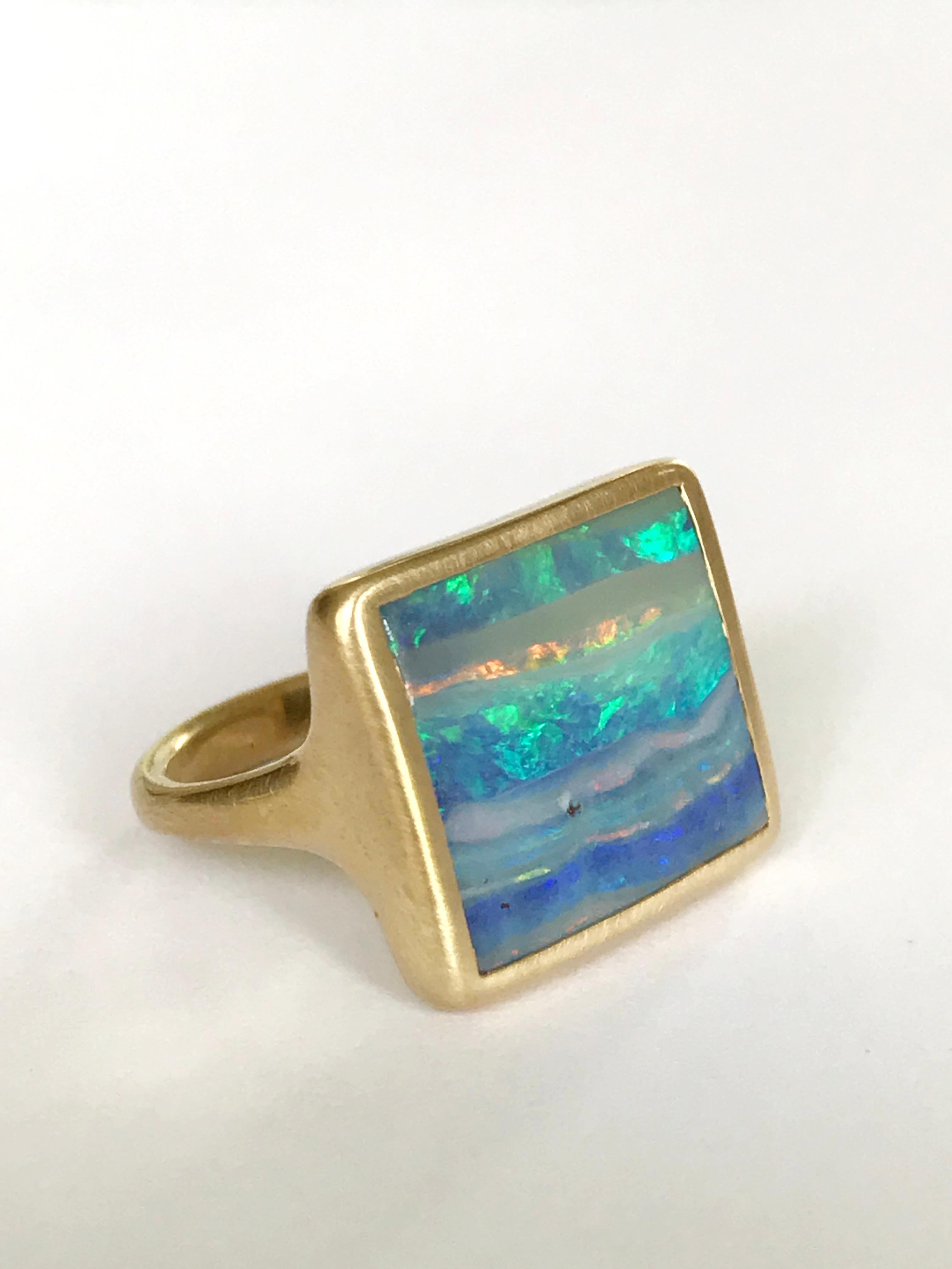Dalben design One of a kind 18k yellow gold matte finishing ring with a bezel-set lovely Blue-green Australian Boulder Opal .  
This Australian Boulder Opal has the waves seabed colors 
Ring size 7 - EU 54 + re-sizable to most finger sizes.  
Bezel