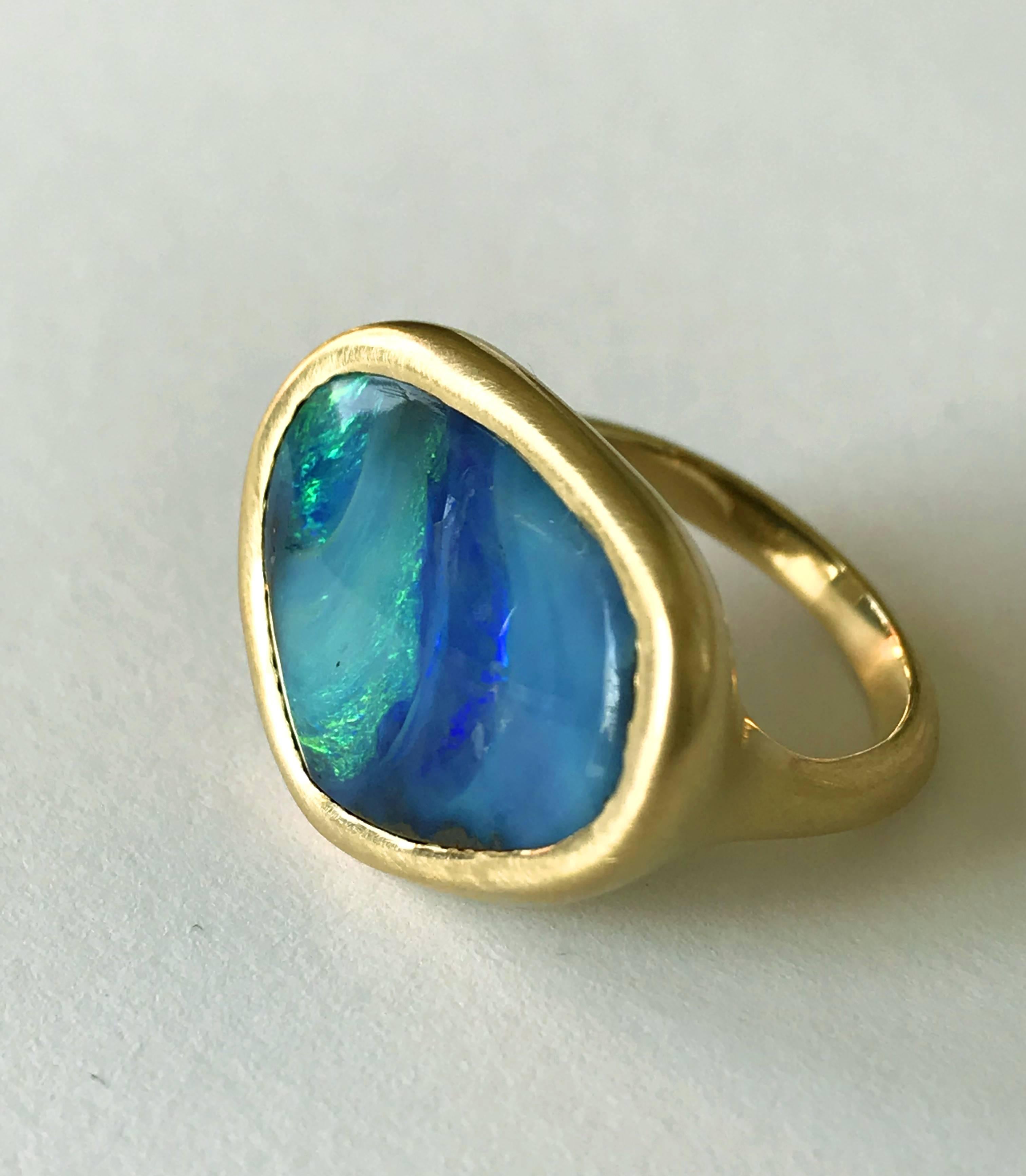 Dalben design One of a kind 18k yellow gold semi lucid finishing ring with a 9,6 carat bezel-set lovely Blue-green Australian Boulder Opal .  
This Australian Boulder Opal has the seabed colors 
Ring size 6 3/4 - EU 54 re-sizable to most finger