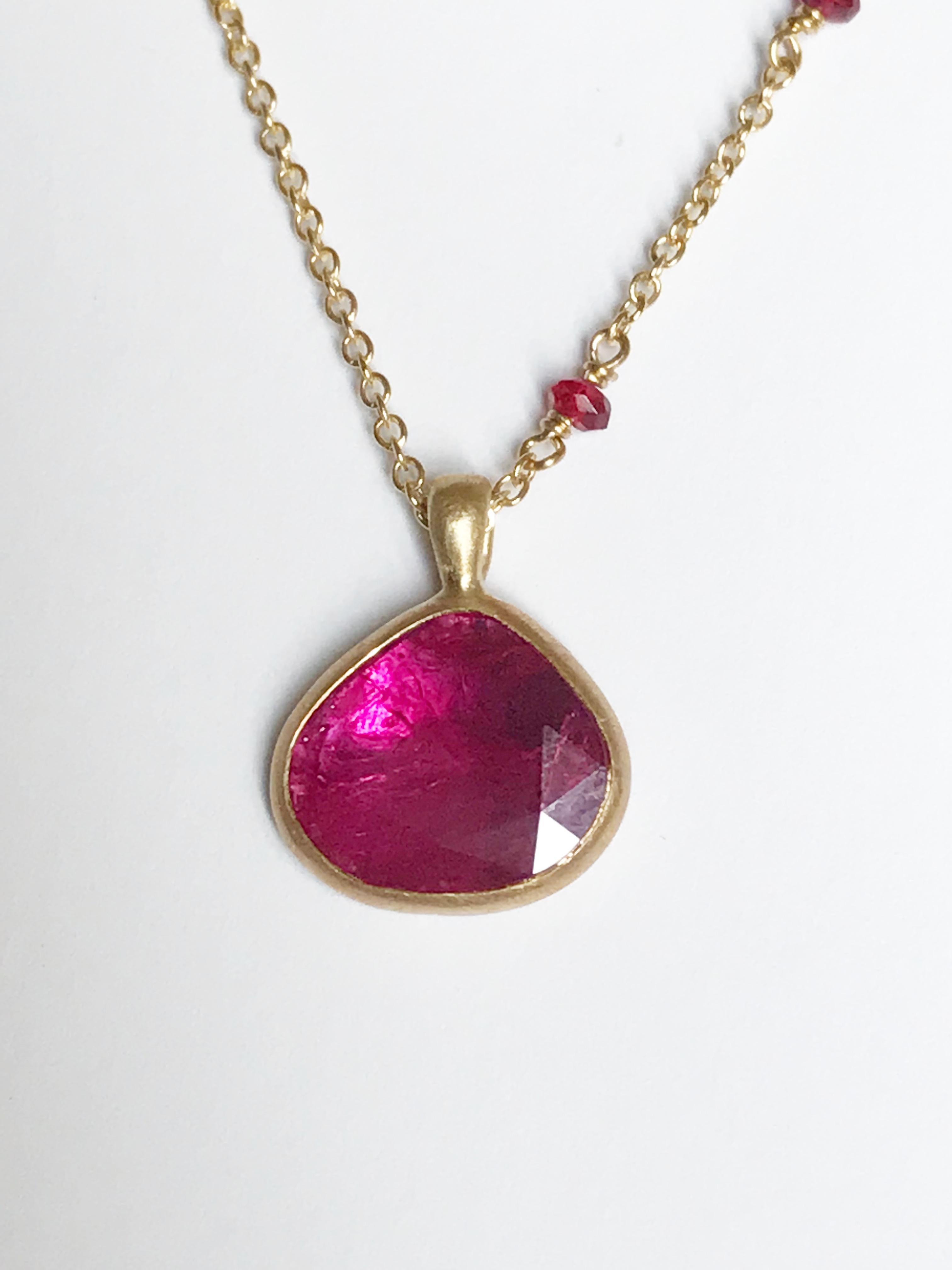 Dalben design One of a Kind 18k yellow gold matte finishing necklace with one bezel-set drop shape rose cut slice ruby weight 1,4 carat. 
pendant dimension : 
width 11,3 mm 
height 11 mm 
The chain is alternated with red spinel faceted bead mounted