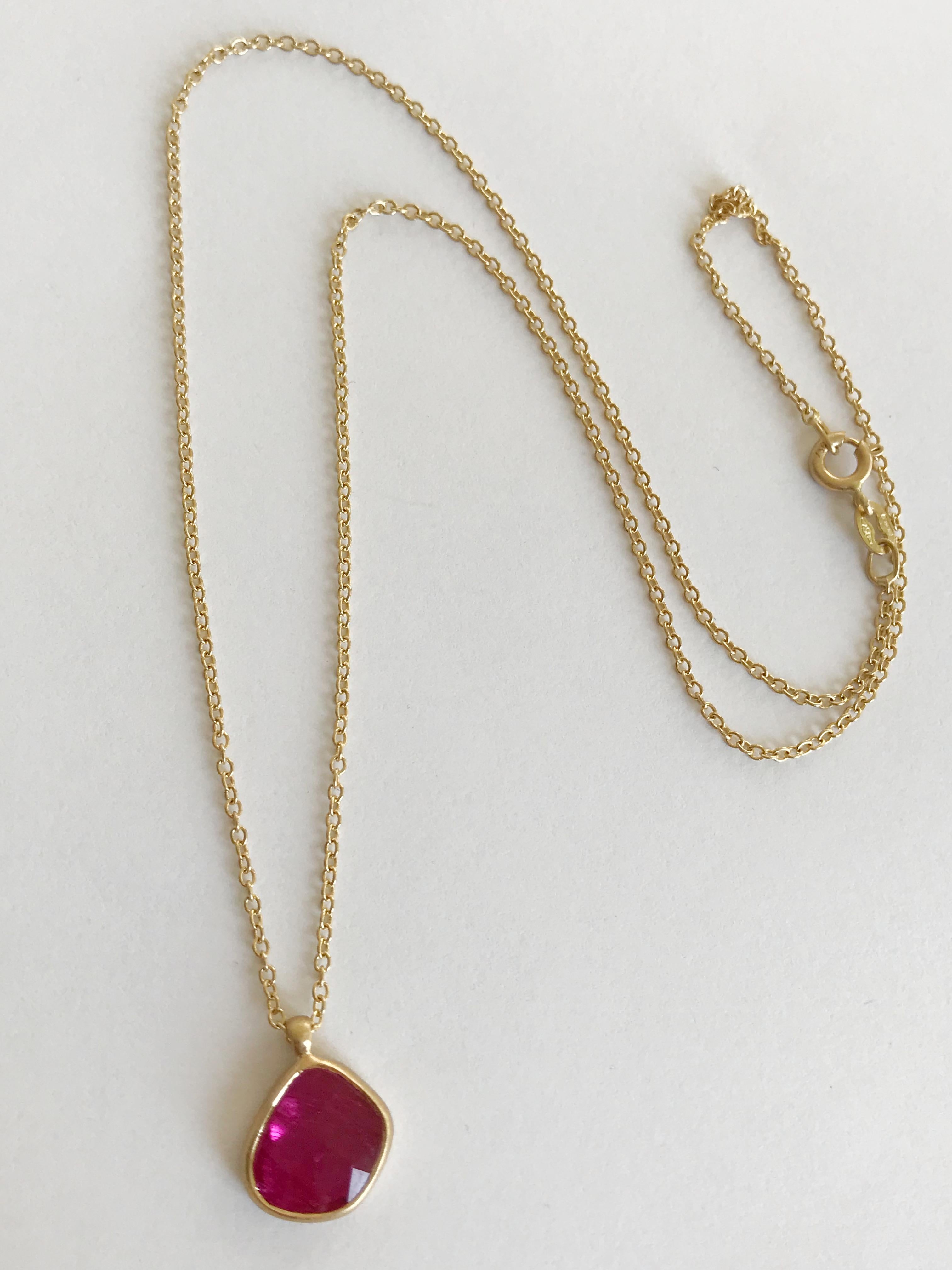Dalben design One of a Kind 18k yellow gold matte finishing necklace with one bezel-set irregular drop shape rose cut slice ruby weight 1,5 carat. 
pendant dimension : 
width 11 mm 
height 11,4 mm 
Chain length 40,5 cm resizable
The necklace has