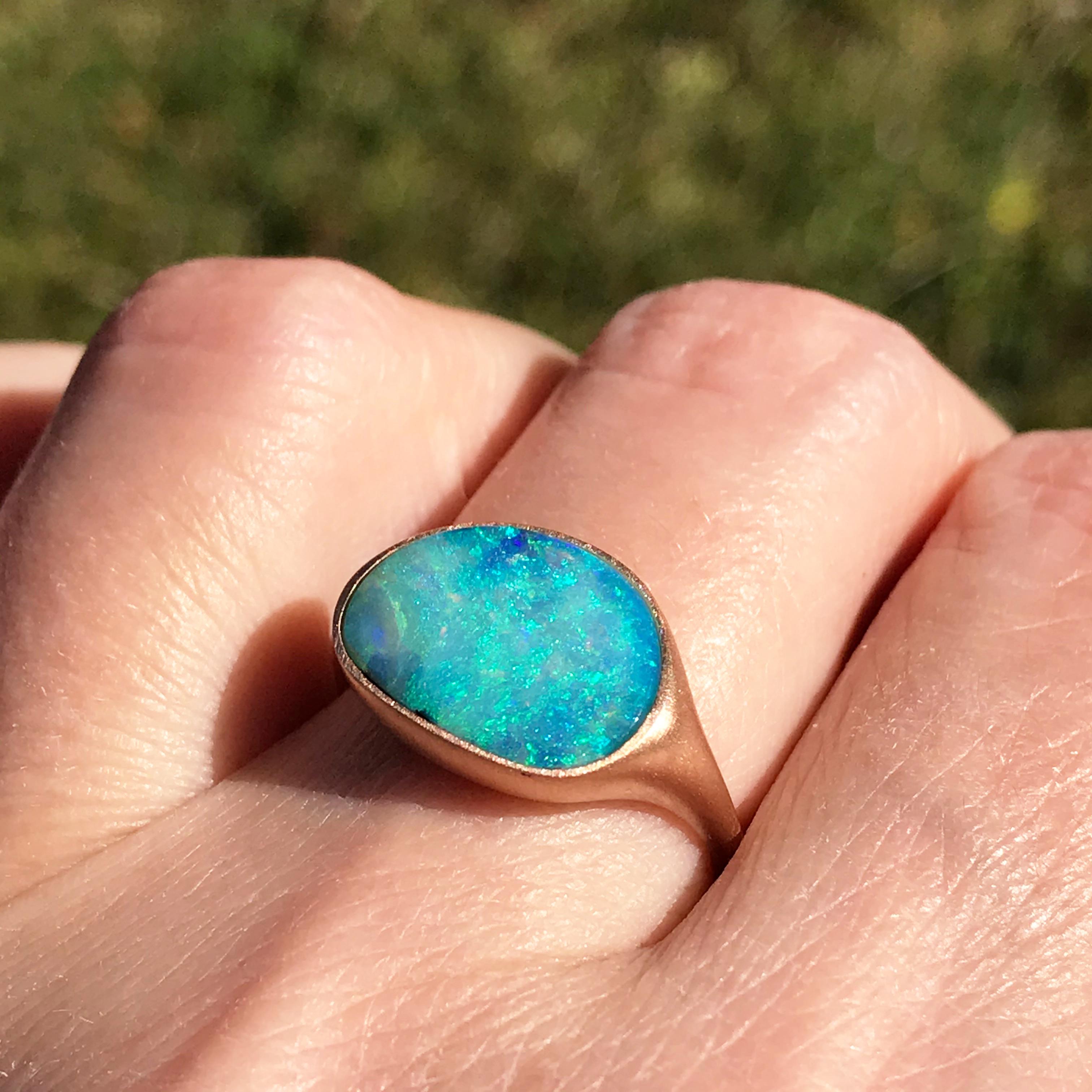 Dalben design One of a kind 18 kt rose gold satin finishing ring with a 3,93 carat bezel-set Australian Boulder Opal .  
The stone has deep light blue colors with green light spots.
Ring size 6 3/4 - EU 54 re-sizable to most finger sizes.  
Bezel