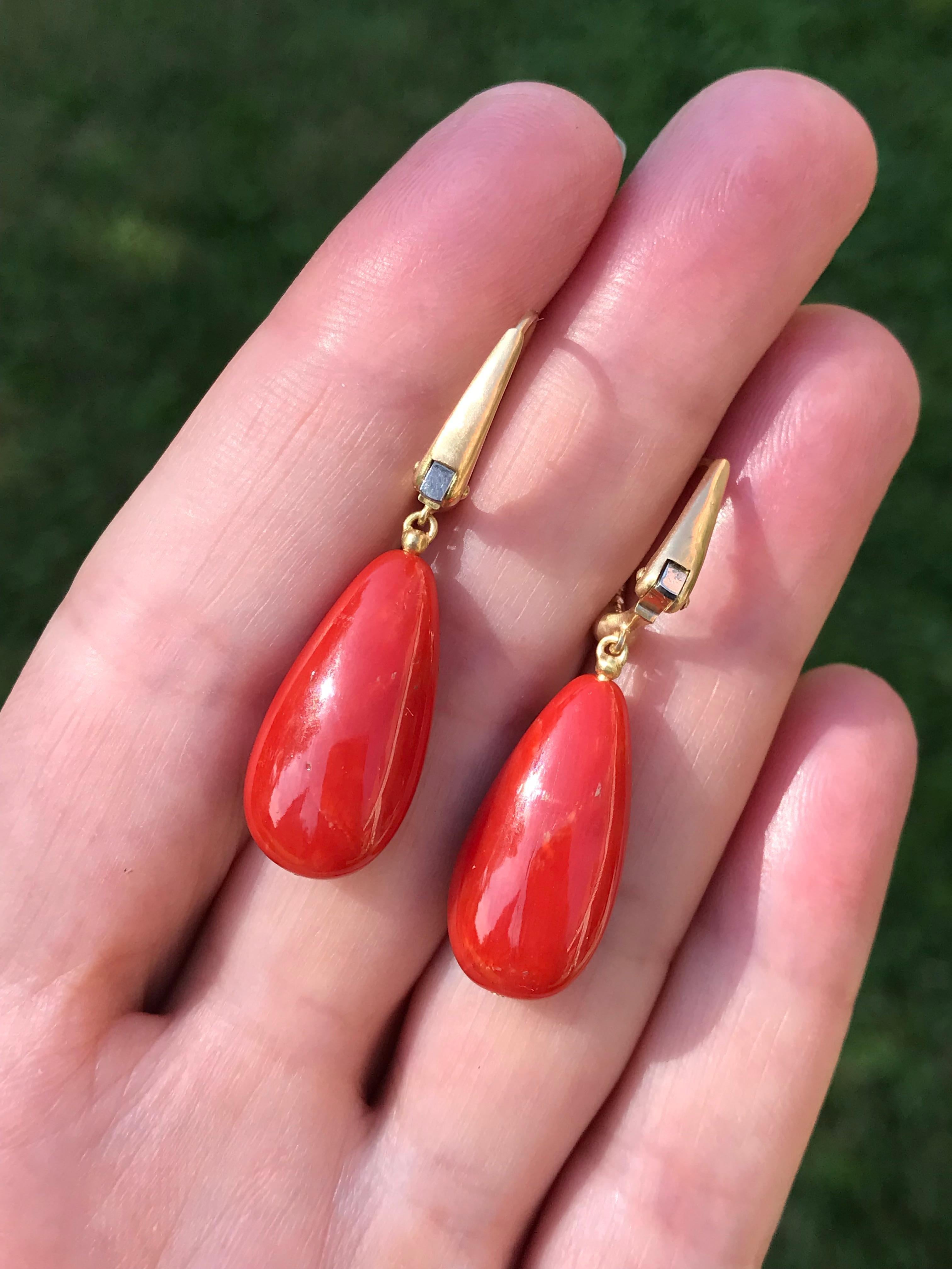 Dalben design 18 kt semi-lucid finished yellow gold earrings with two long drop shape Mediterranean Red Coral 10,8 x 21,4 mm  weight 23 carat . 
Earrings dimension :  
width 10,8 mm 
height with leverback 37,6 mm  
The earrings has been designed and