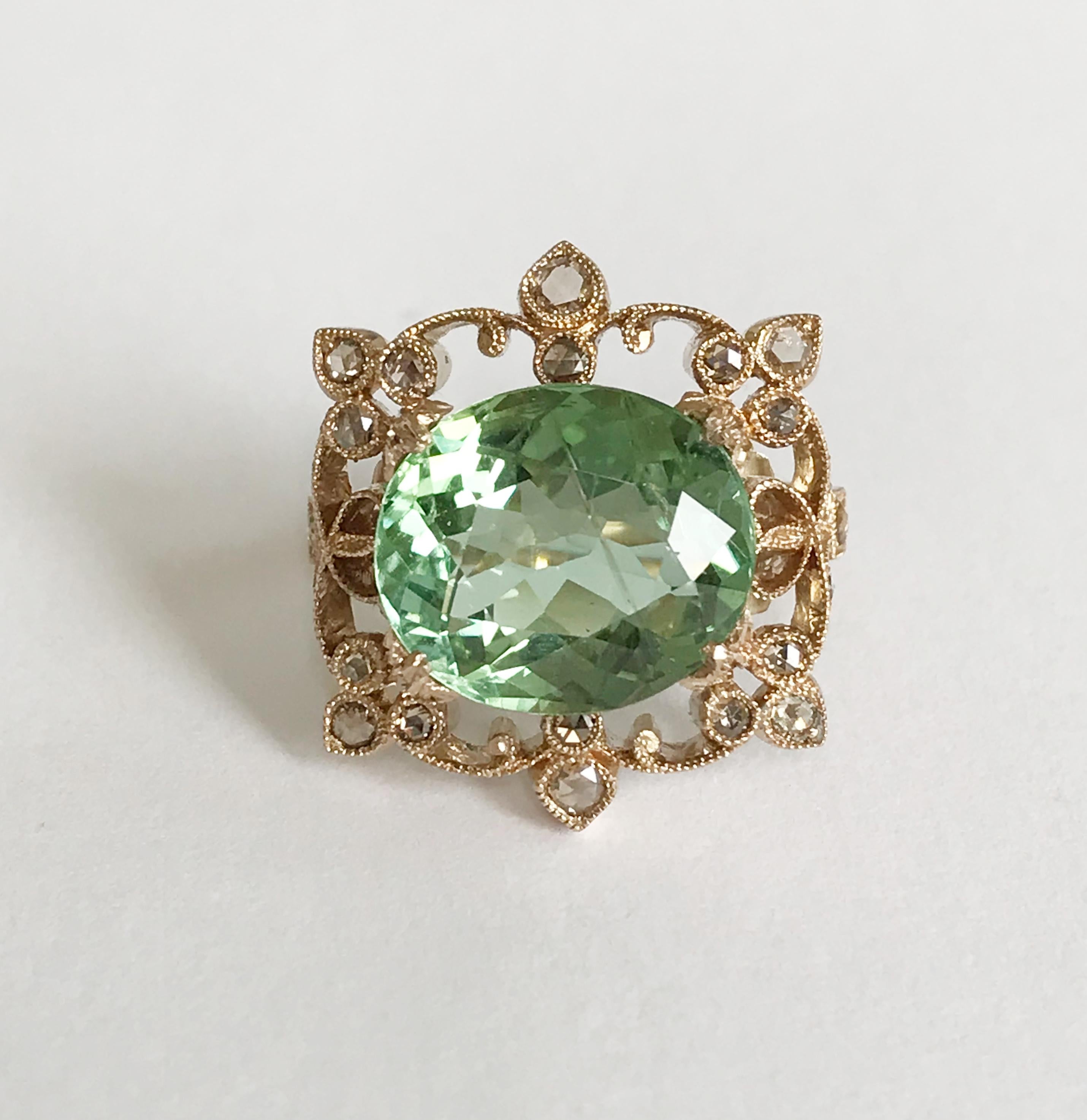Dalben design Green Tourmaline and brown Diamond Ring mounted in 18 kt warm white gold. One Oval cut Green Tourmaline weighting 6,98 carat and 22 rose cut brown Diamonds weighting 0,45 carats. Ring size 7 1/4 USA - 55 EU resizable to most finger