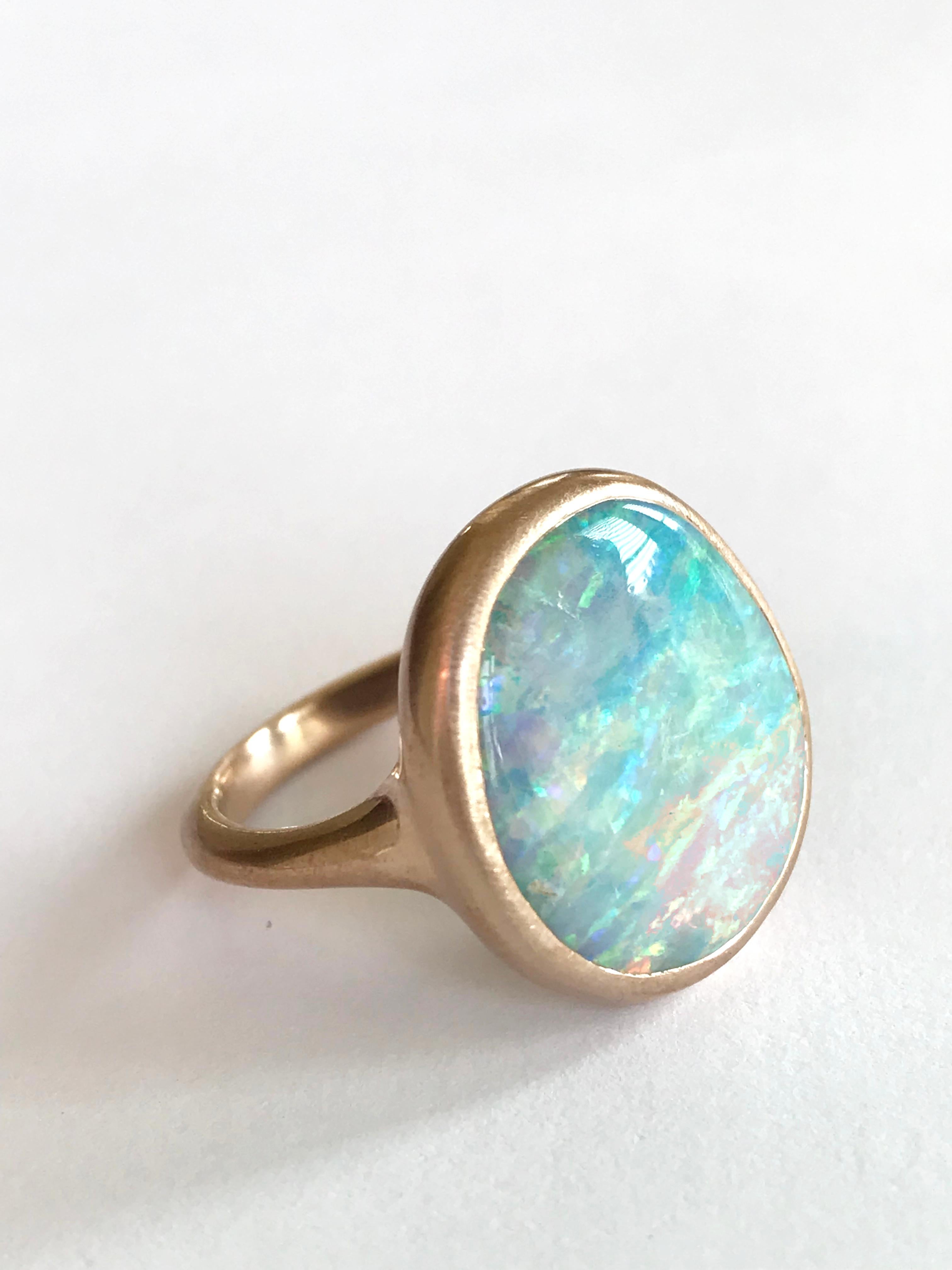 Dalben design One of a kind 18 kt rose gold matte finishing ring with a 9,8 carat bezel-set wonderful Australian Boulder Opal .  
The stone has pastel colors with blue , green , pink and yellow light spots.
Ring size 6 3/4 - EU 54 re-sizable to most