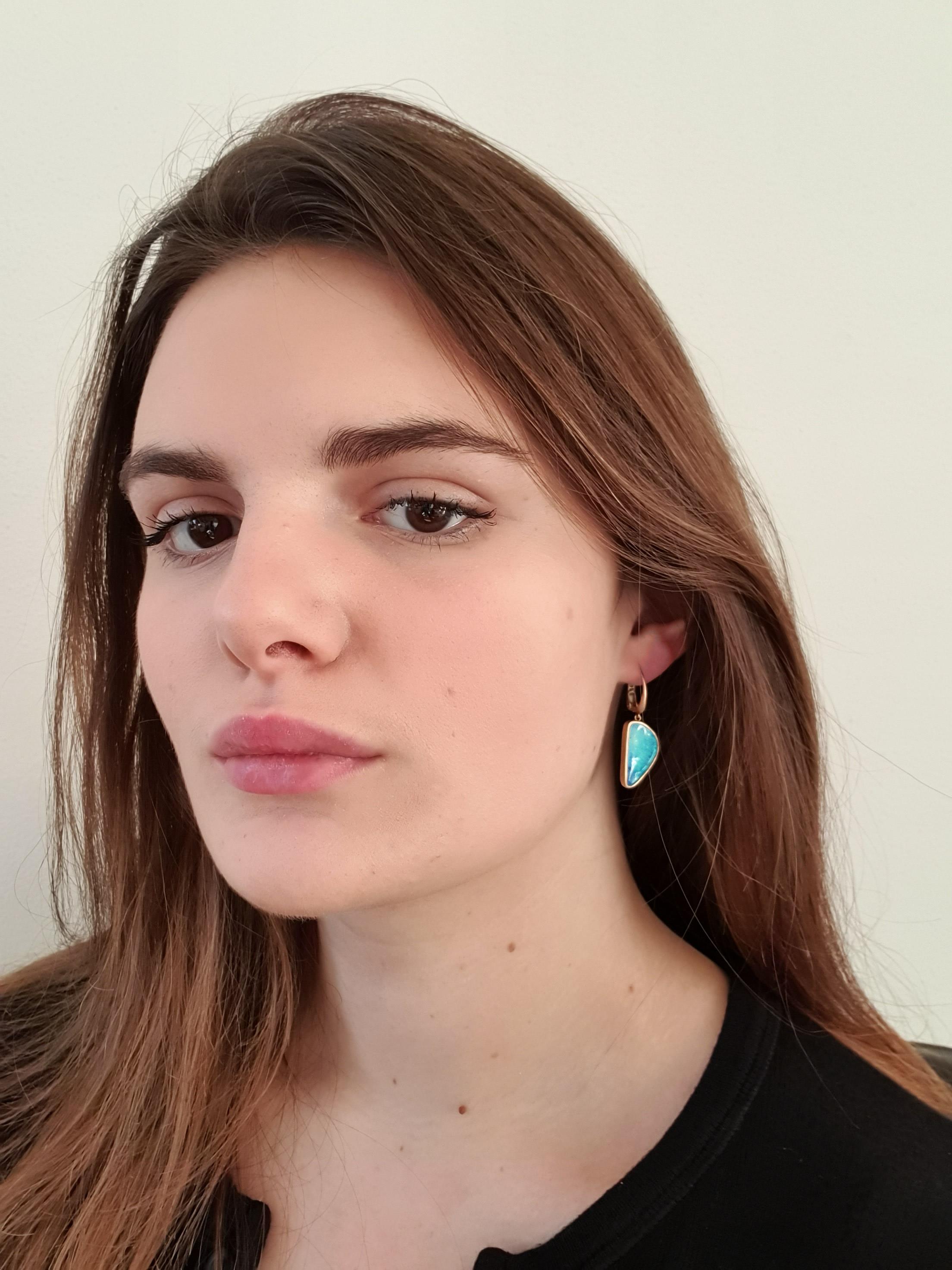 Dalben design One of a kind 18k yellow gold semi lucid finishing dangle earrings with two deep light blue bezel set Australian Boulder Opals weighing 12 carats.  
This Australian Boulder Opals has magnificent Mediterranean sea colors 
Opal Dimension