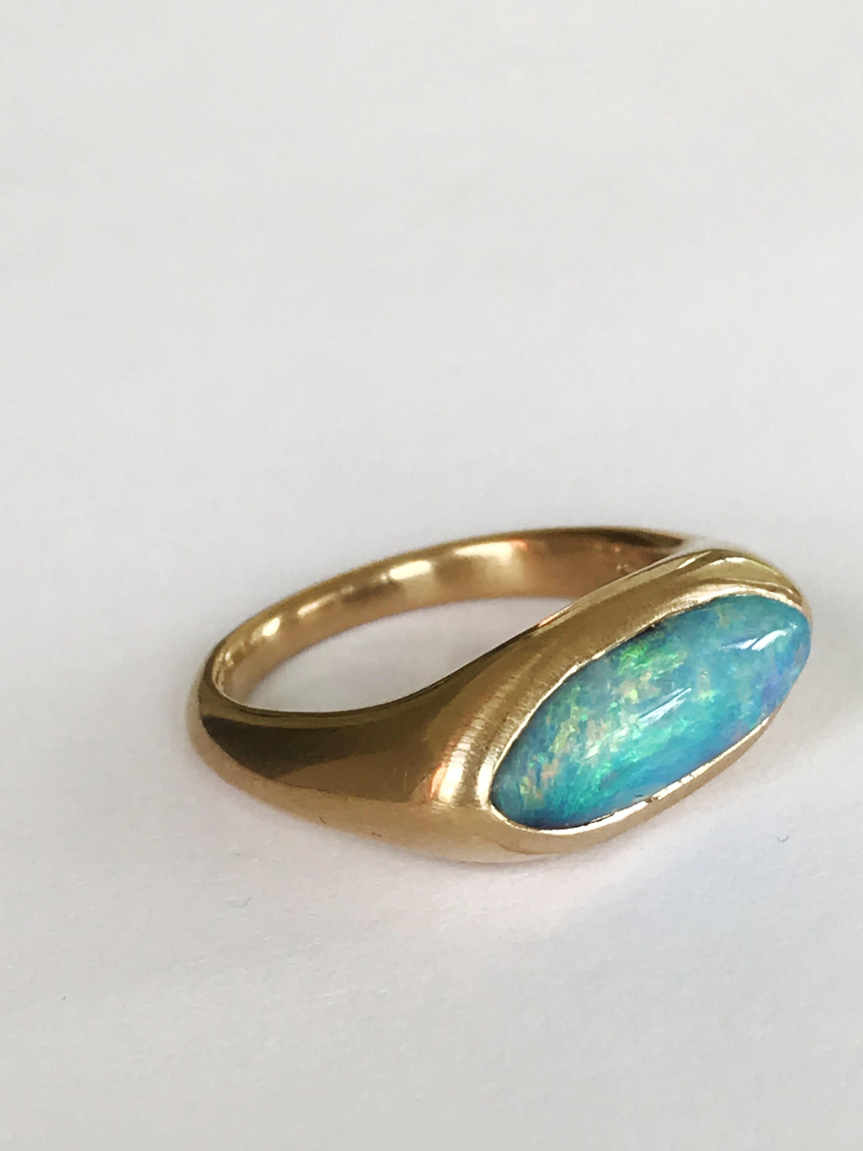 Dalben design One of a kind 18 kt yellow gold ring with a 3,15 carat bezel-set deep light blue navette shape Australian Boulder Opal  .  
Ring size 7 1/4 - EU 55 re-sizable .  
Bezel setting dimension:  
max width 18,5 mm,  
max height 8,9 mm. 
The