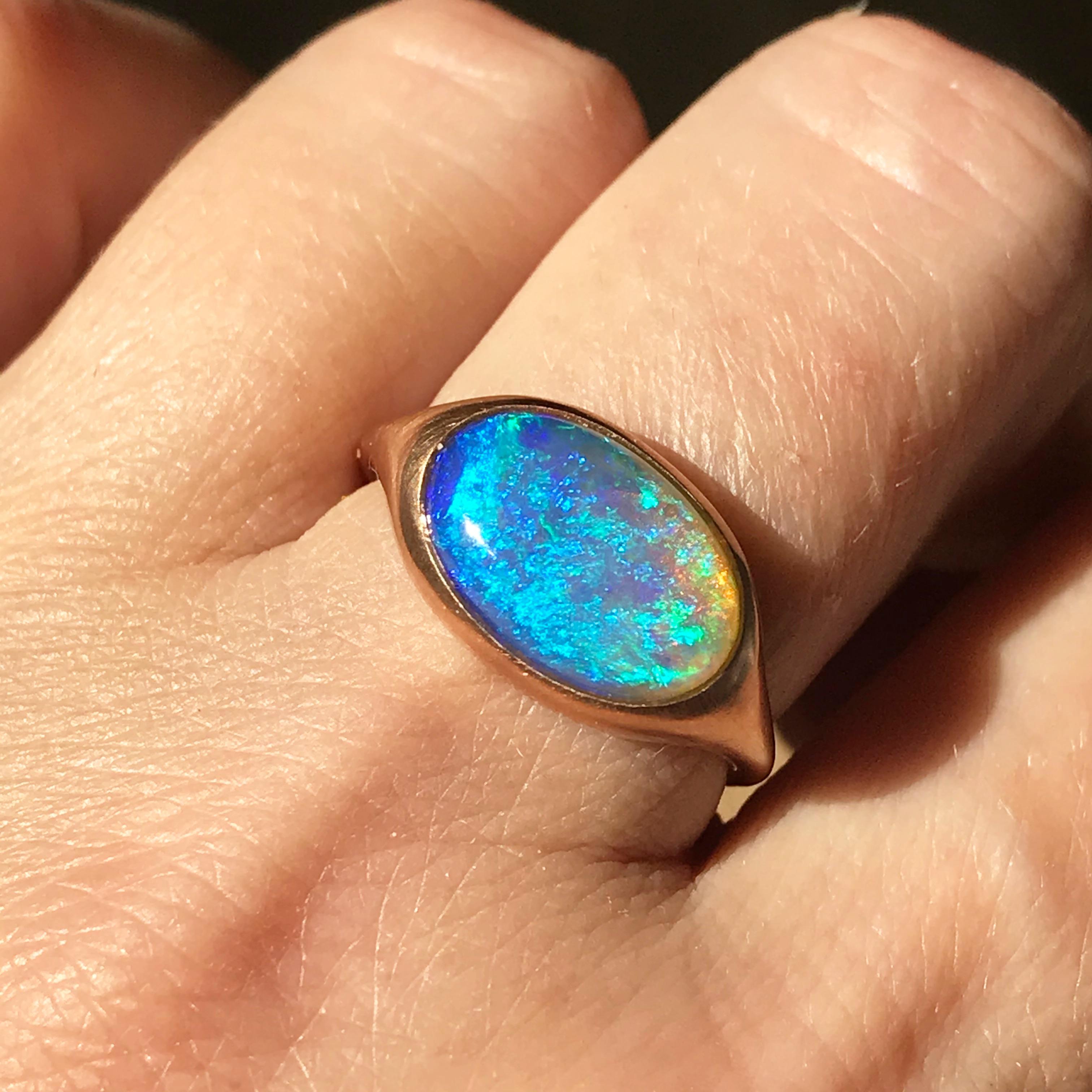 Dalben design One of a kind 18 kt rose gold matte finishing ring with a 3,31 carat bezel-set  oval deep blue lovely Lightning Ridge Australian Opal  .  
The stone has deep blue green spots .
Ring size 7 1/4 - EU 55 re-sizable to most finger sizes. 
