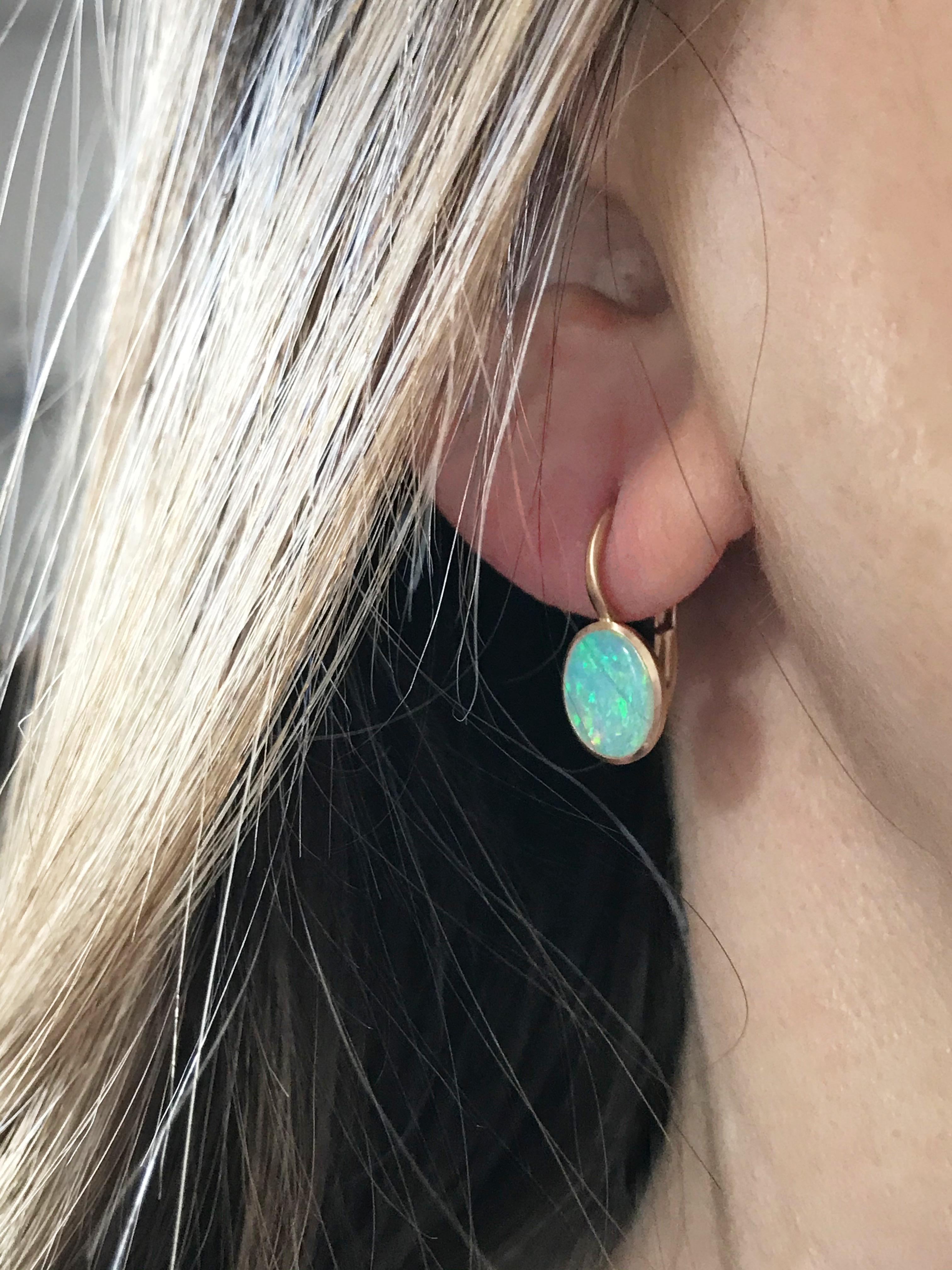 Dalben design  18k rose gold matte finishing small earrings with two bezel-set oval cabochon green blue Australian solid opals weight 1,77 carats . 
Bezel stone dimensions :
 width 8 mm
height without leverback 9,7 mm
height with leverback 18 mm
The