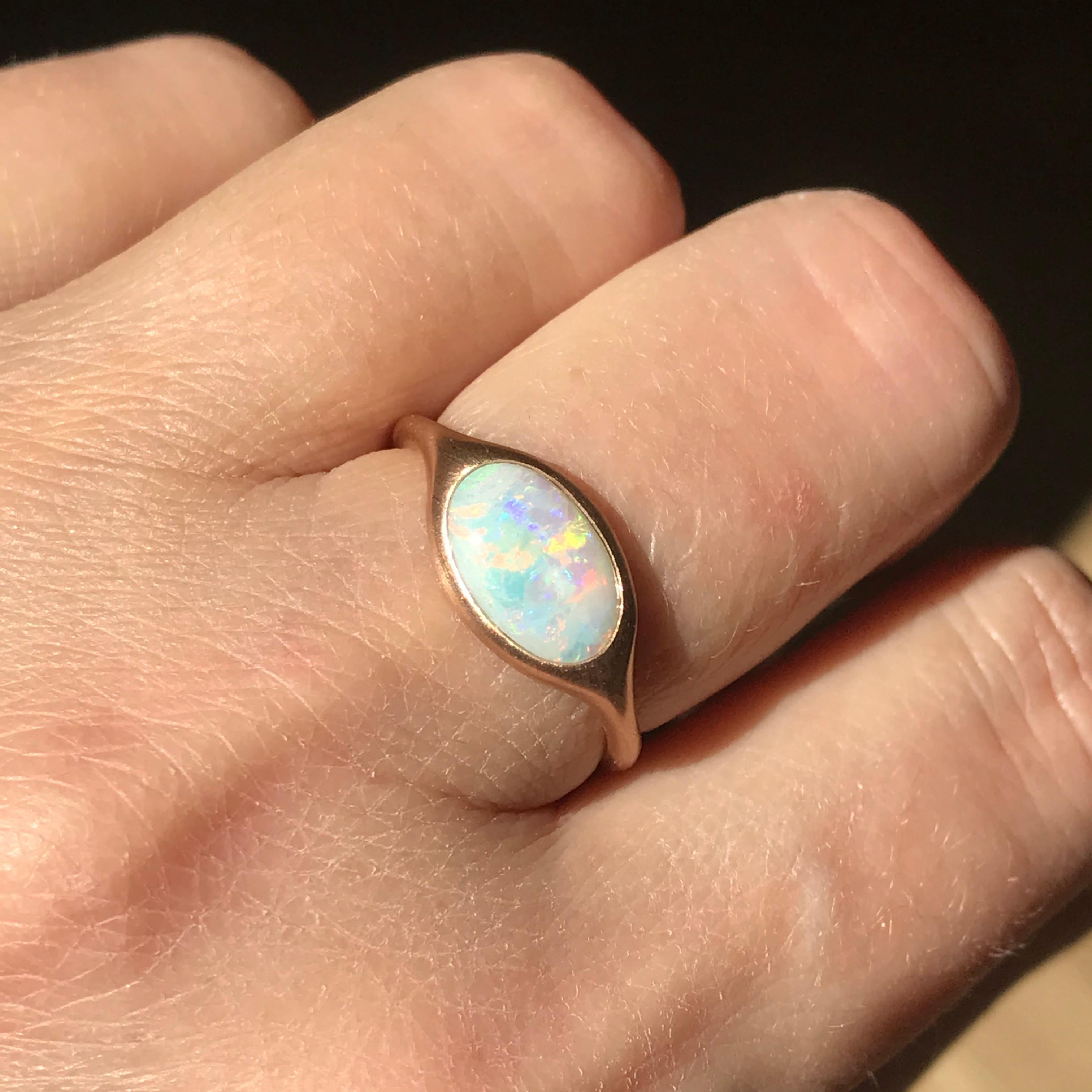 Dalben design 18k rose gold satin finishing ring with a 0,9 carat bezel-set oval shape Australian crystal opal . 
Ring size US 7 - EU 54 re-sizable to most finger sizes. 
Bezel setting dimension: 
width 12,3 mm, 
height 8,1 mm. 
The ring has been