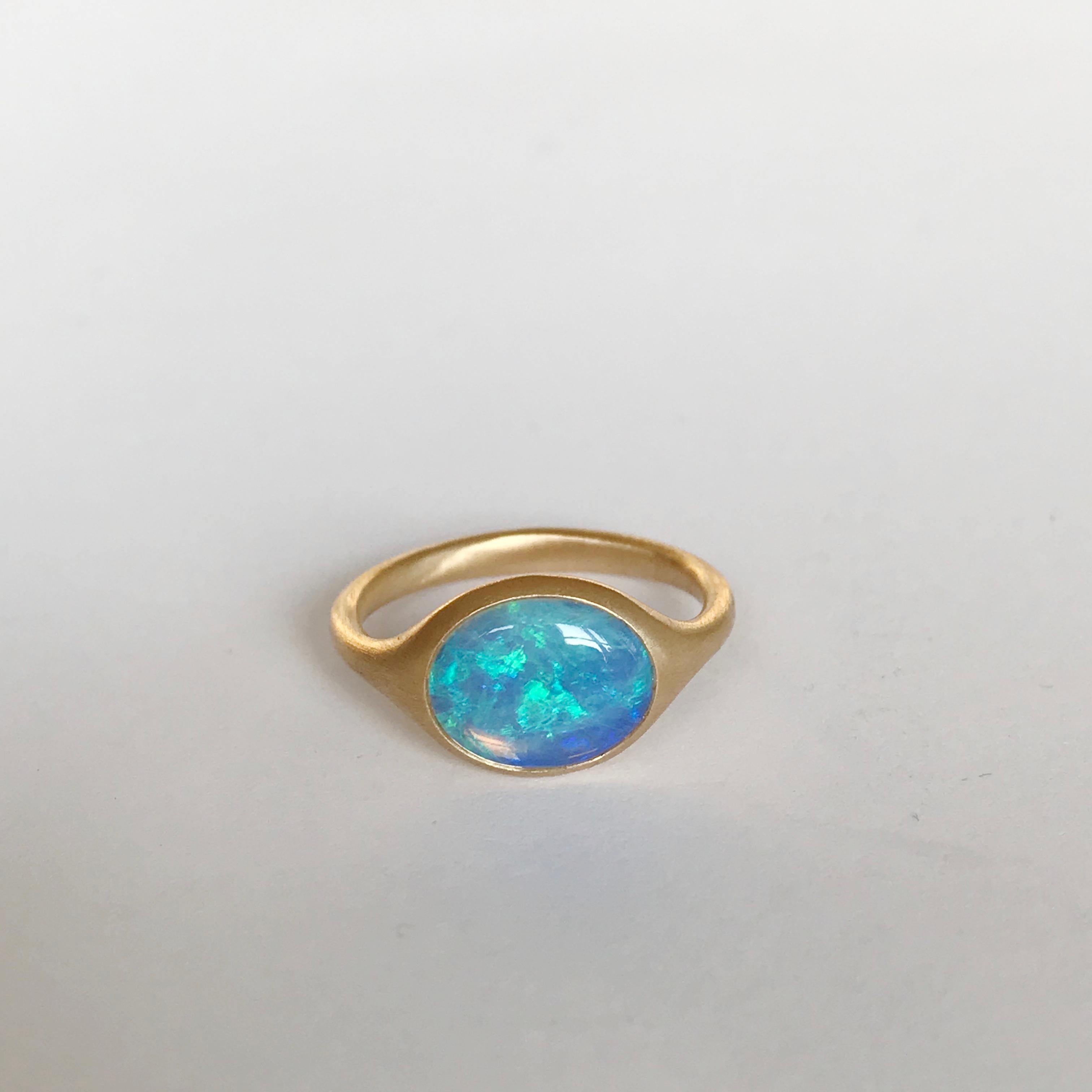 Dalben design 18k yellow gold semilucid finishing ring with a  1,54 carat bezel-set small oval cabochon Australian Opal .   
Ring size 5 3/4 - EU 51 re-sizable to most finger sizes. 
Opal dìimension : 10 x 8 mm 
Bezel setting dimension: 
width 11,8