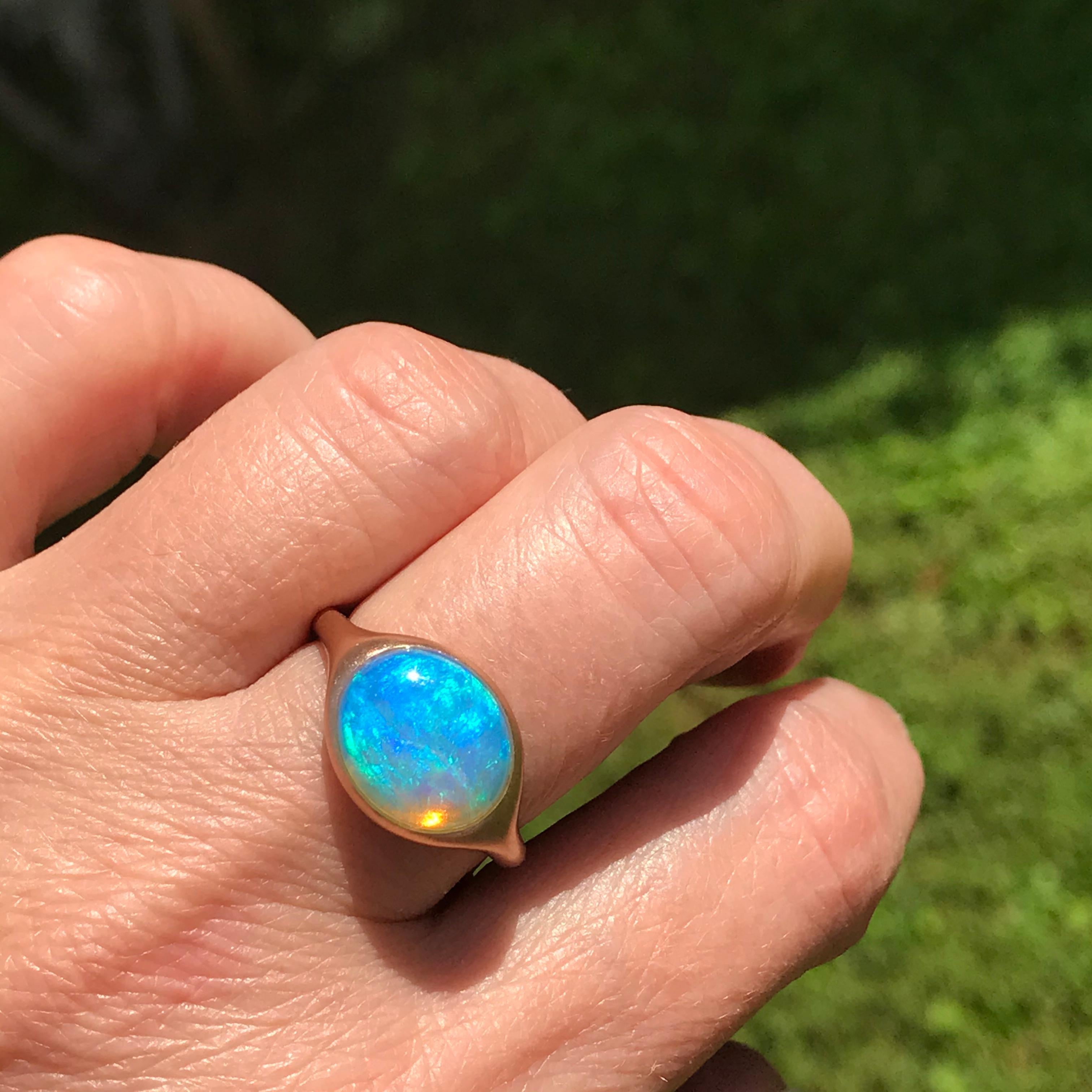 Dalben design One of a kind 18 kt rose gold matte finishing ring with a 4,32 carat bezel-set  oval deep light blue lovely Australian Opal  .  
Ring size 7 1/4 - EU 55 re-sizable to most finger sizes.  
Bezel setting dimension:  
max width 15 mm, 