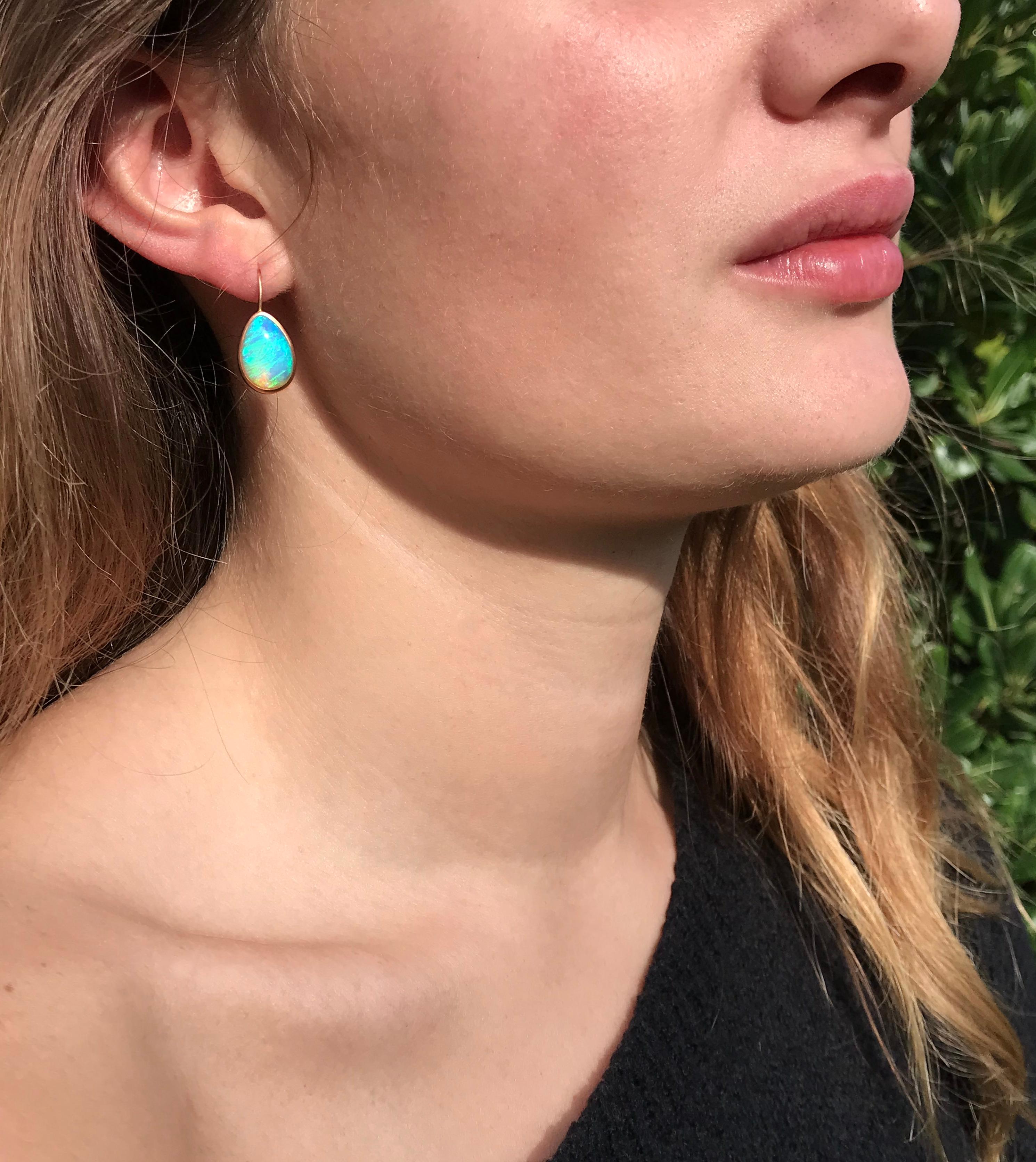 Dalben design  18k rose gold matte finishing small earrings with two bezel-set oval cabochon blue Australian solid opals weight 6,53 carats . 
Bezel stone dimensions :
width 10,6 mm
height without leverback 15 mm
height with leverback 23 mm
The
