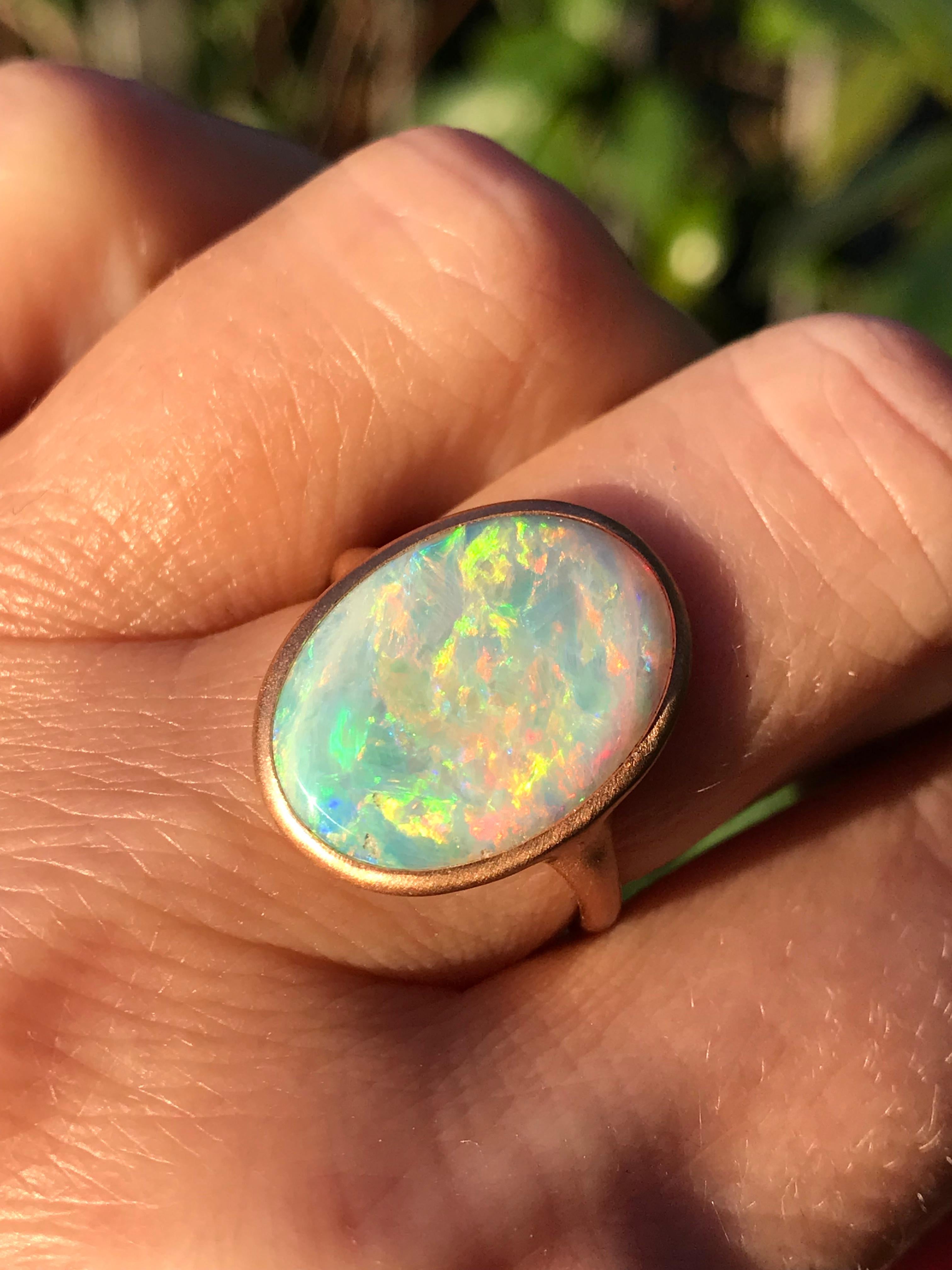 Dalben design One of a kind 18 kt rose  gold ring with an oval cabochon solid Australian Crystal Opal weight 4,09 carats from Coober Pedy  .
The opal has  wonderful blue green reflex especially at sunshine 
Ring size  US 7  -  EU 54 re-sizable . 