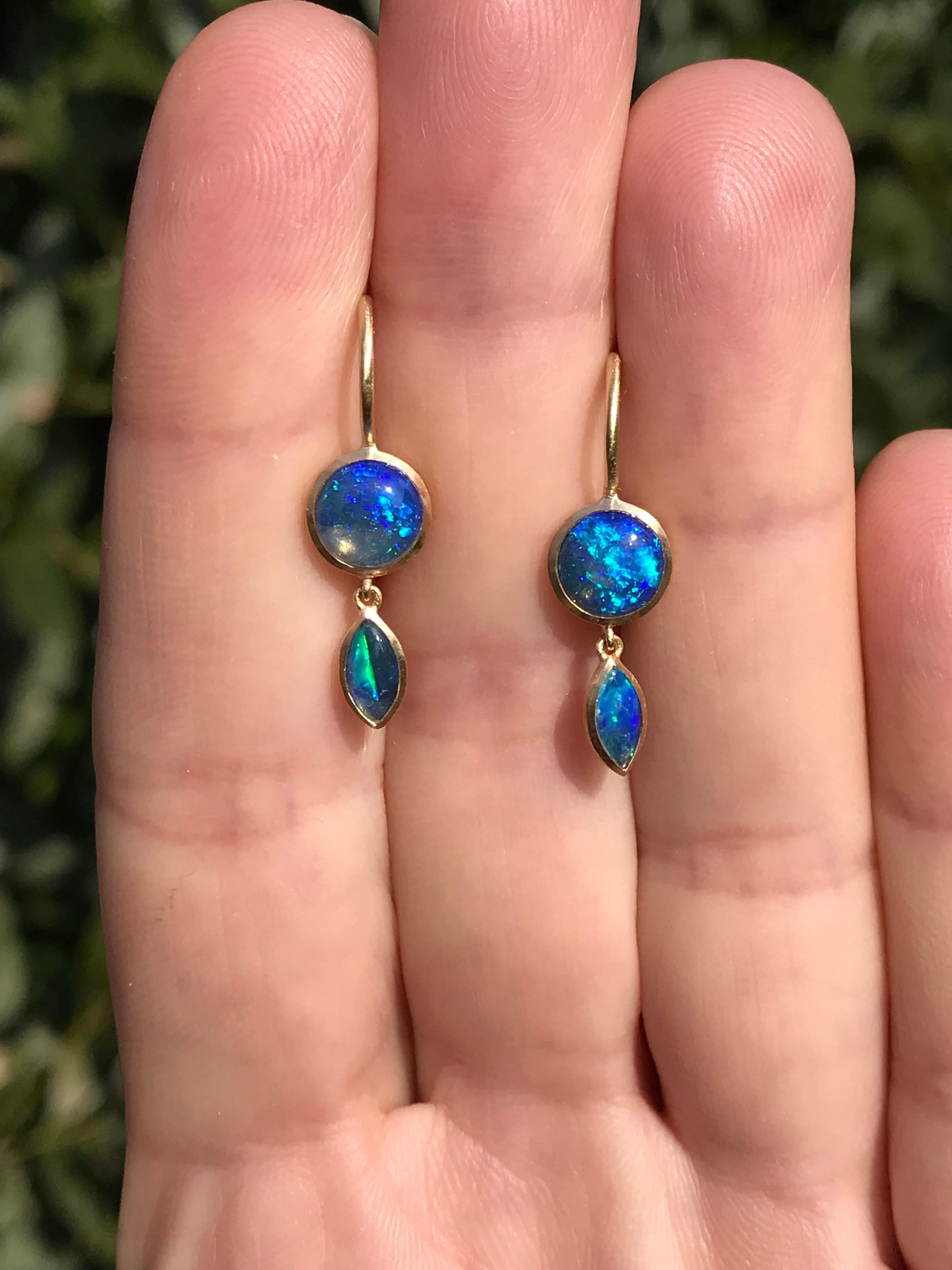 Dalben design  18k yellow gold satin finishing lever back earrings with two round cabochon cut and two navette cut blue Australian solid opals weight 1,24 carats . 
Bezel stone dimensions  7,1 mm .
height with leverback 23,5 mm
The earrings has been