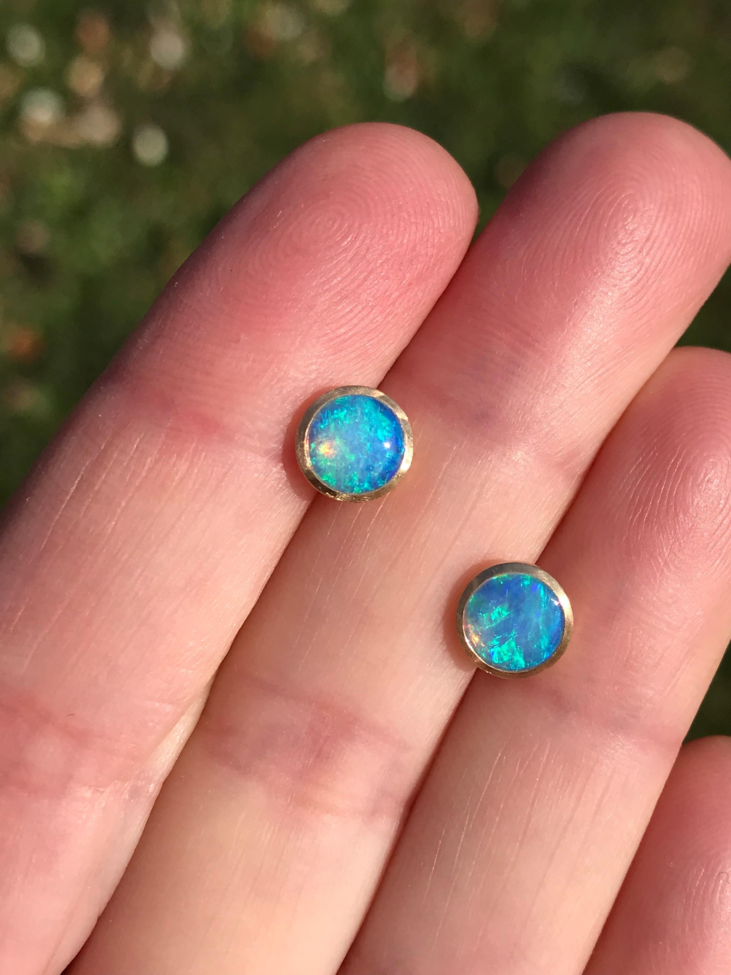 Dalben design  18k yellow gold satin finishing stud earrings with two bezel-set round cabochon blue Australian solid opals weight 0,8 carats . 
Bezel stone dimensions  7,15 mm .
The earrings has been designed and handcrafted in our atelier in Como