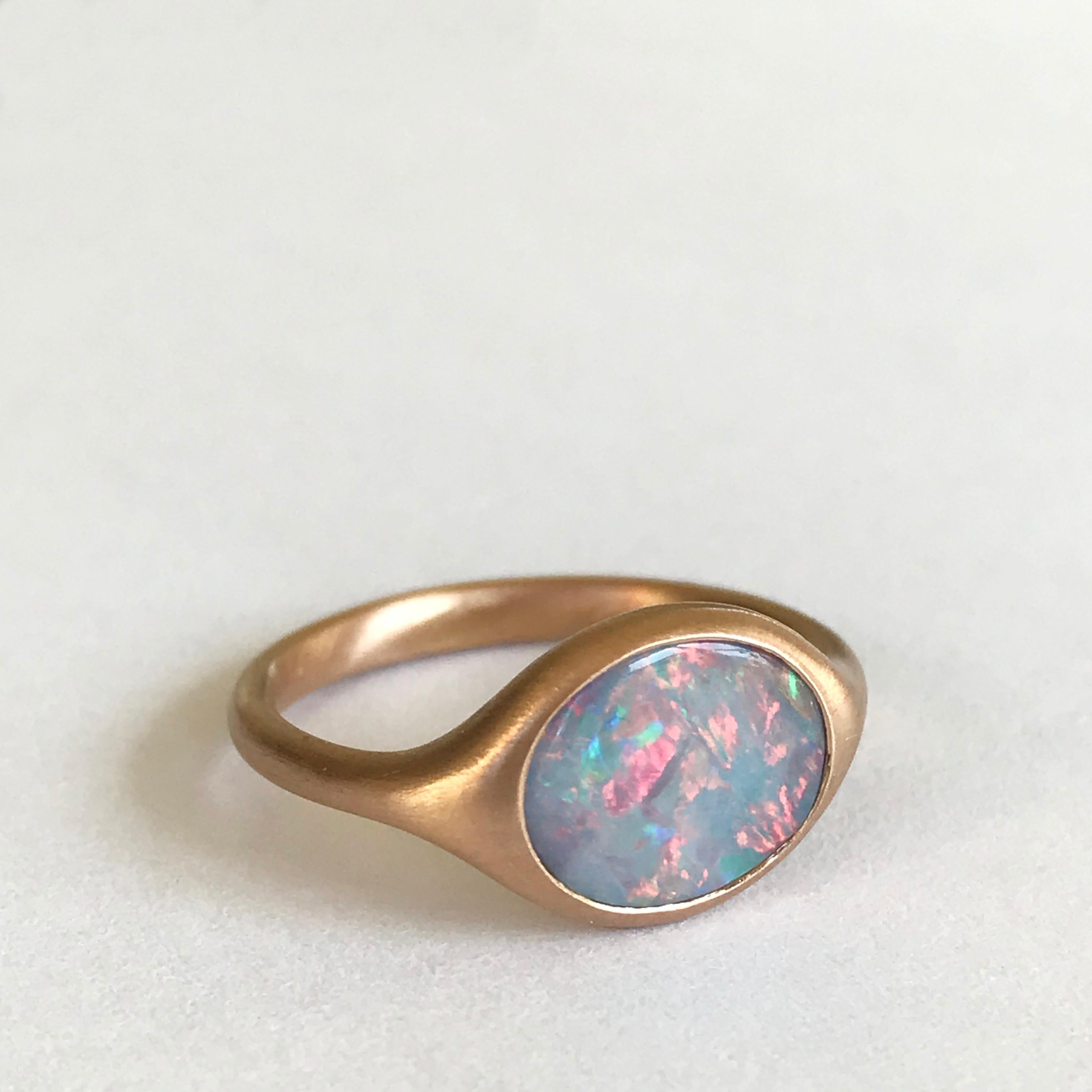 Dalben design 18k yellow gold semilucid finishing ring with a 1,48 carat bezel-set small oval cabochon Australian Opal . 
Ring size 5 3/4 - EU 51 re-sizable to most finger sizes. 
Opal dìimension : 10 x 8 mm 
Bezel setting dimension: 
width 11,6 mm,