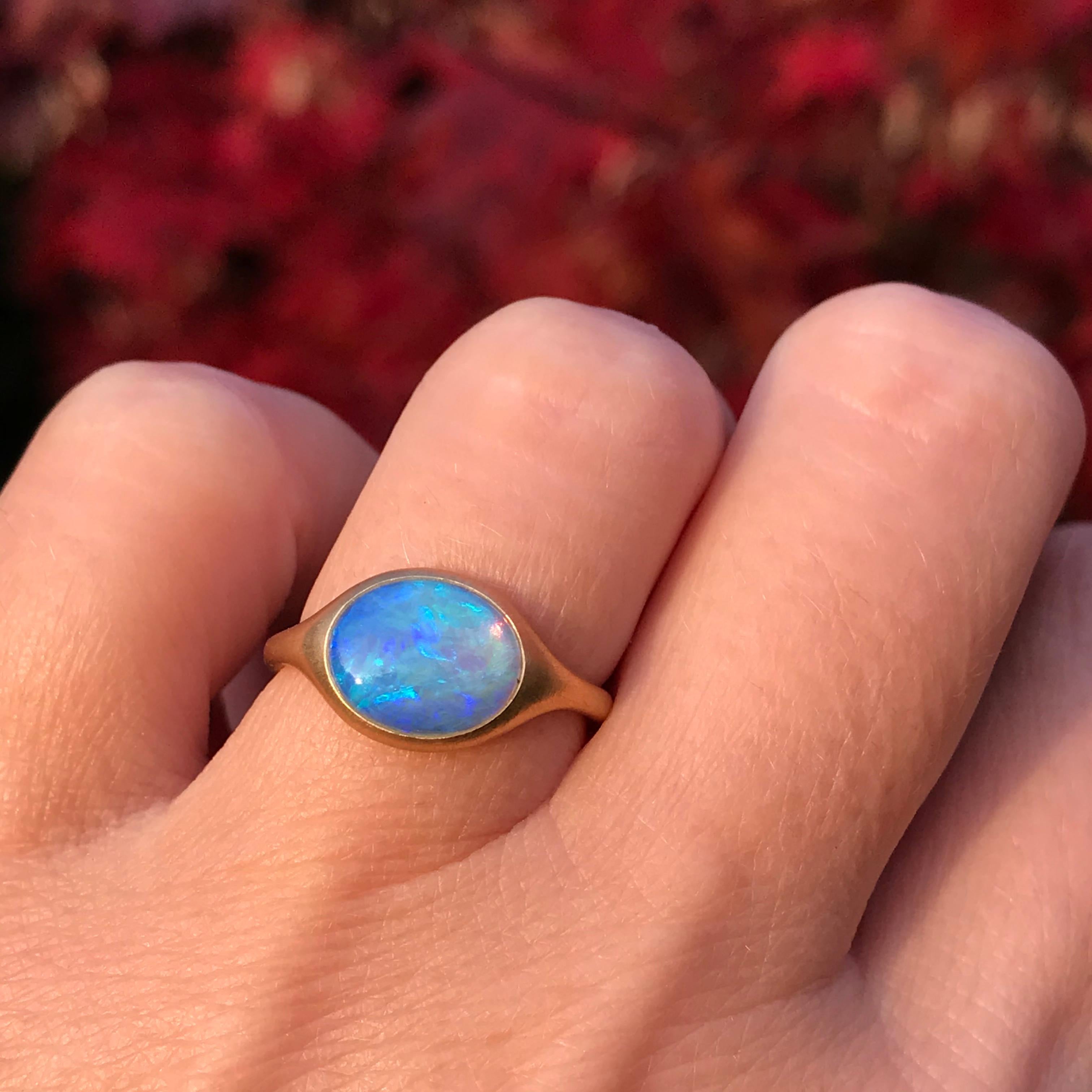 Dalben design 18k yellow gold semilucid finishing ring with a  1,54 carat bezel-set small oval cabochon Australian Opal .   
Ring size 5 3/4 - EU 51 re-sizable to most finger sizes. 
Opal dìimension : 10 x 8 mm 
Bezel setting dimension: 
width 11,8