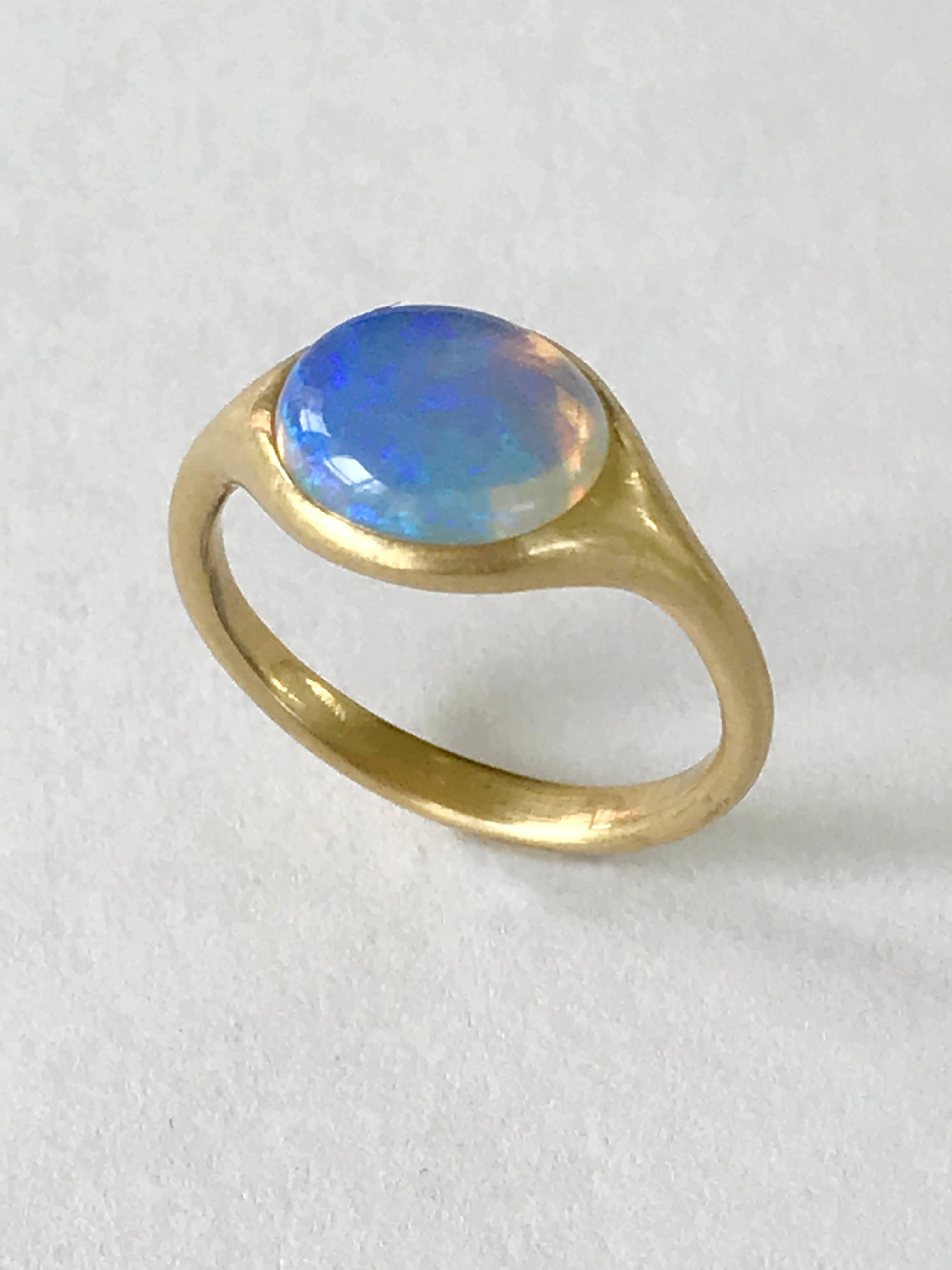 Dalben design 18k yellow gold semilucid finishing ring with a  1,78 carat bezel-set small oval cabochon Australian Opal .   
Ring size 5 3/4 - EU 51 re-sizable to most finger sizes. 
Opal dìimension : 10 x 8 mm 
Bezel setting dimension: 
width 11,6