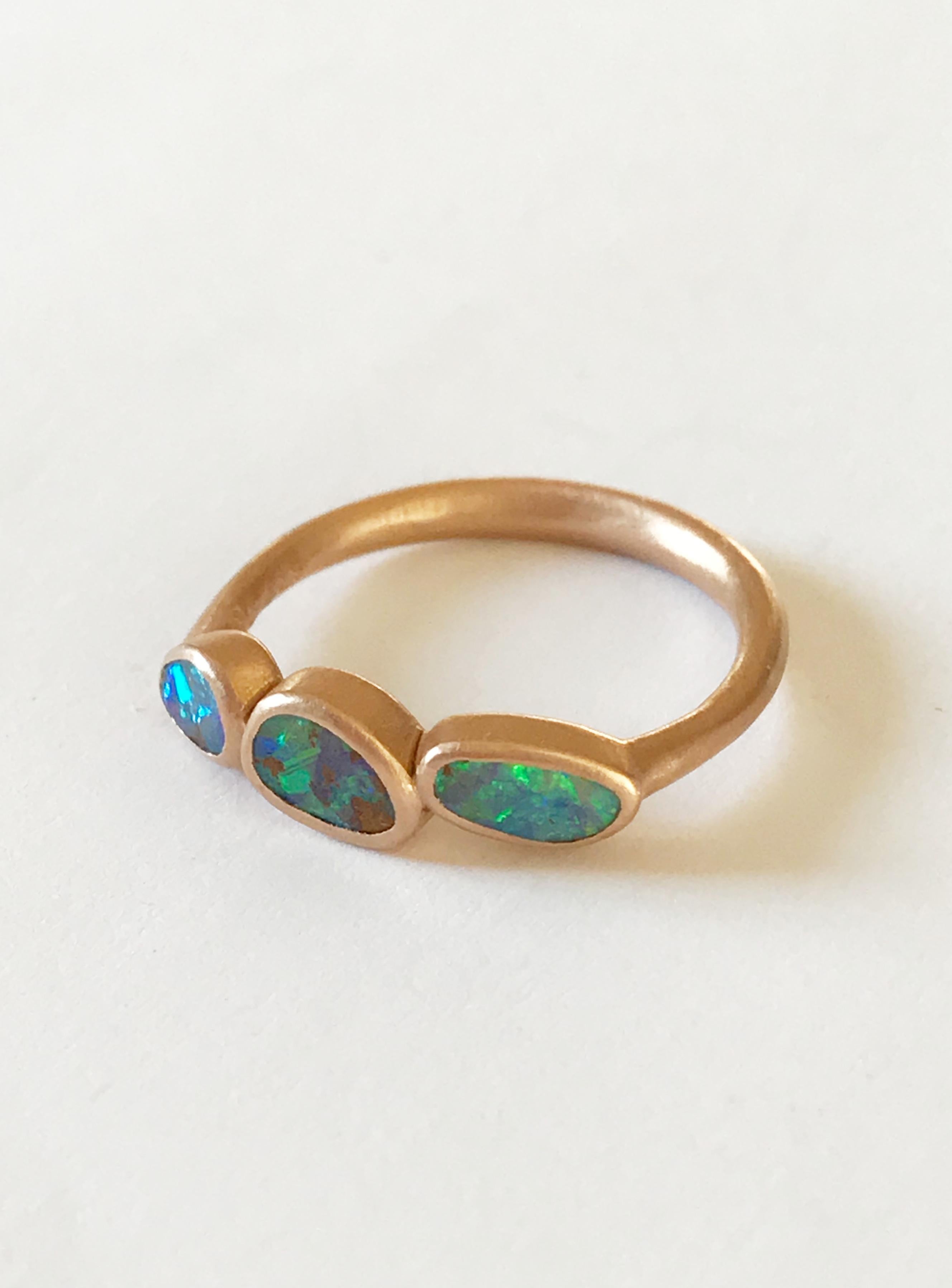 Dalben design One of a kind 18 kt rose gold ring with three bezel-set blue-violet-green Australian Boulder Opals weight 1,19 carats  .  
Ring size  US 7 1/4  - EU 55 re-sizable .  
Bezels setting dimension:  
max width 18,9 mm,  
max height 5,7 mm.