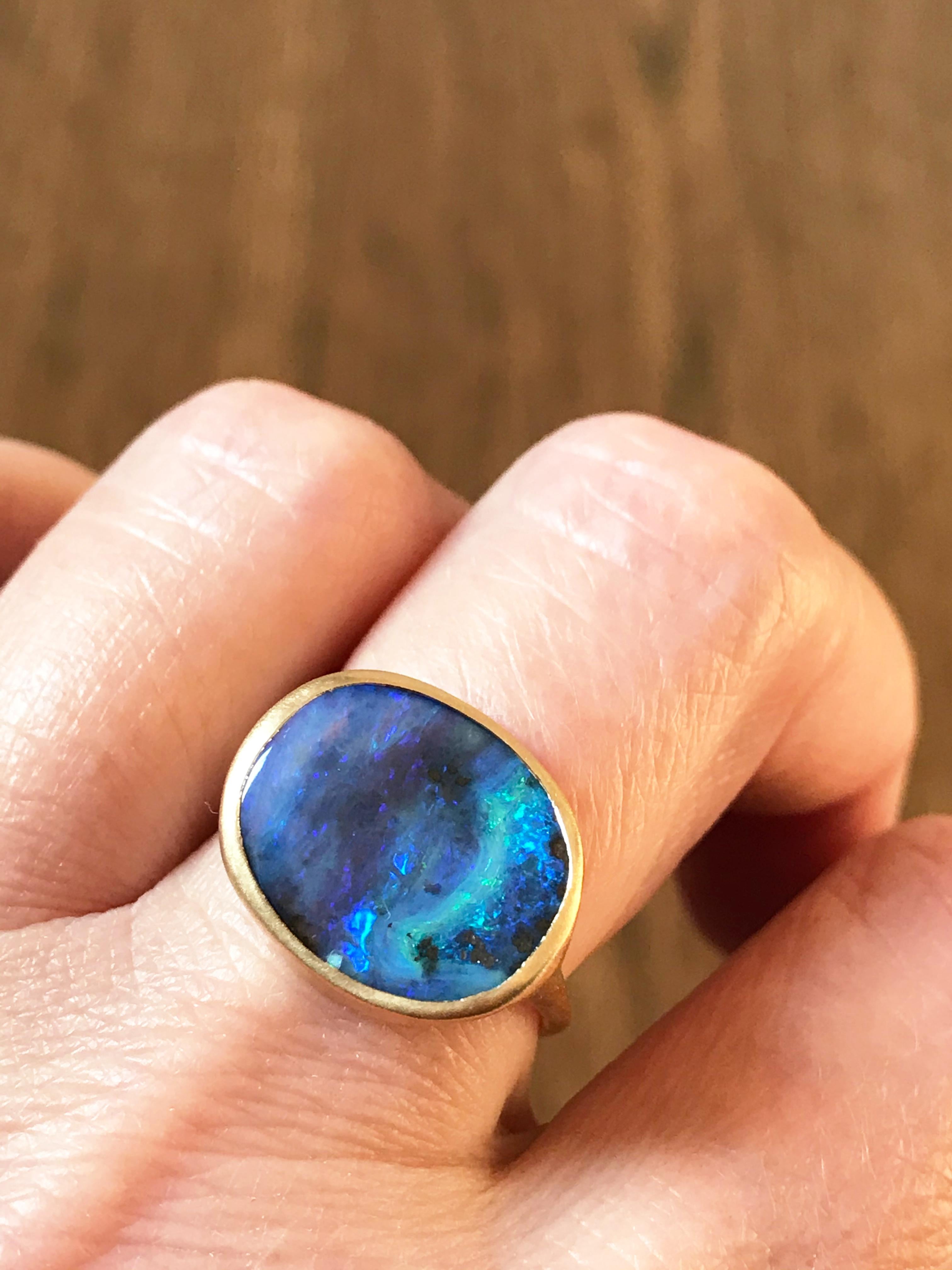 Dalben design One of a kind 18 kt yellow gold satin finish ring with a 5,45 carats bezel-set blue Australian Boulder Opal  .
The Australian Boulder Opal has the deep blue seabed colors
Ring size 6 3/4  - EU 54 re-sizable .  
Bezel setting dimension: