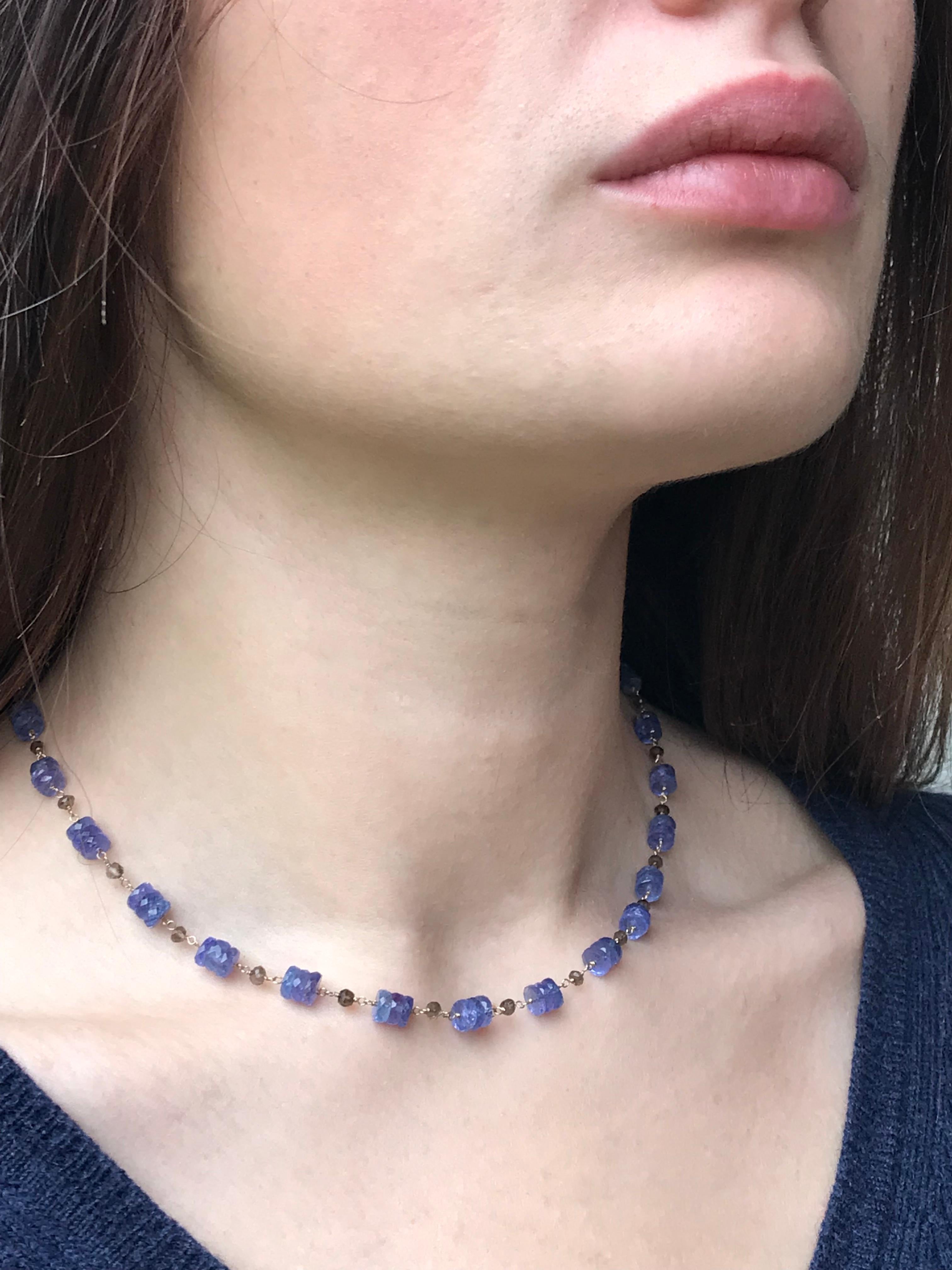 Dalben design hand crafted necklace composed of tanzanite and smoky quartz faceted  rondelle hand-linked with 18 k white gold. The necklace length is 16 inch (41 cm) and the white gold closure is satin hand engraved. 