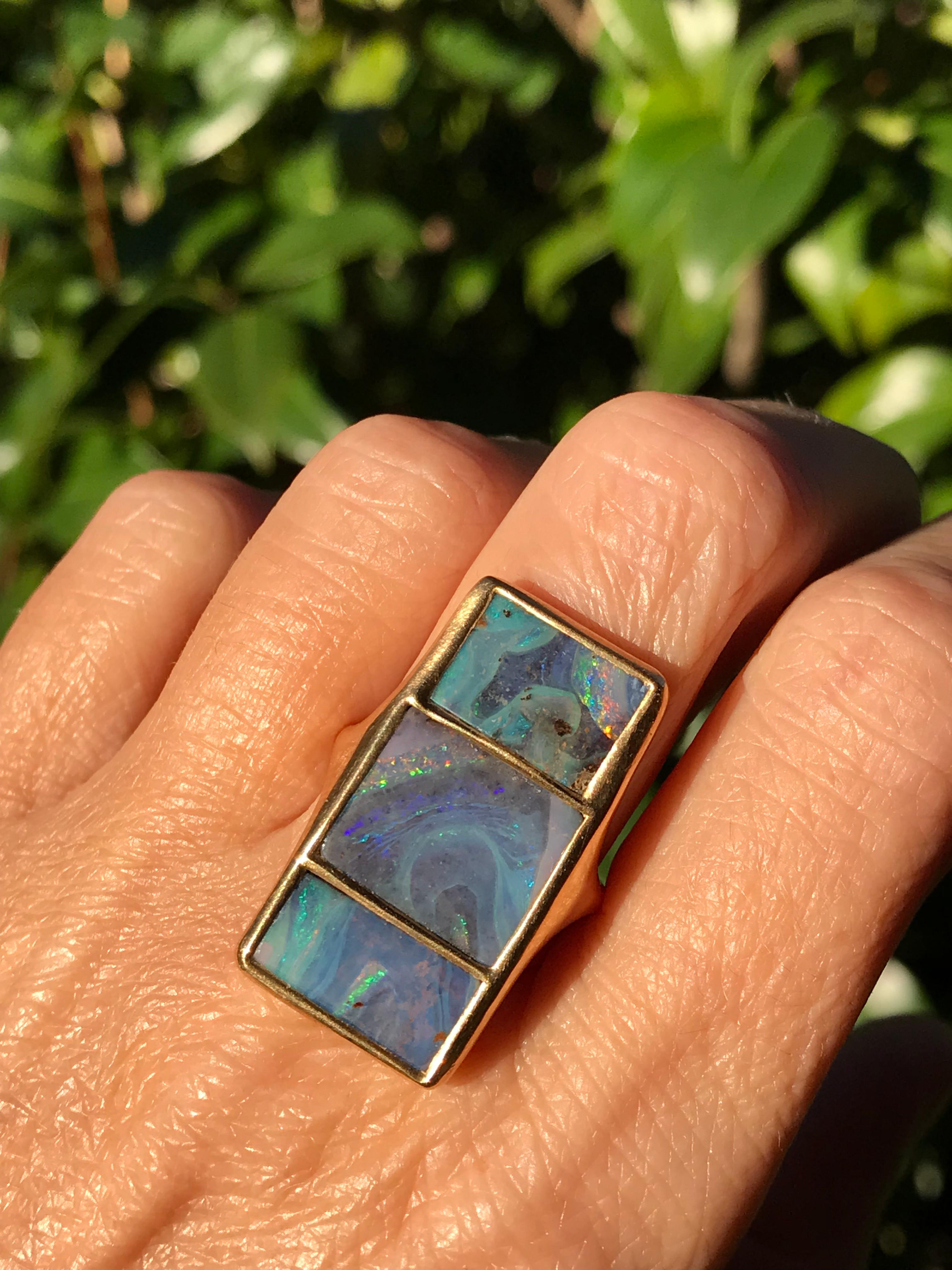Dalben design One of a kind 18k yellow gold matte finishing ring with three  bezel-set Australian Boulder Opals.
Total opals weight  9,6 carat 
Ring size 7 1/4 - EU 55 re-sizable to most finger sizes. 
Bezel setting dimension: width 15 mm, height